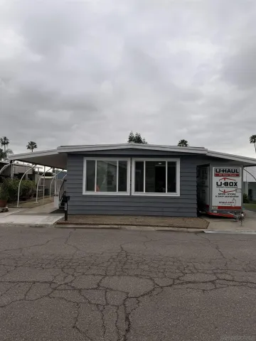 a front view of a house with parking space