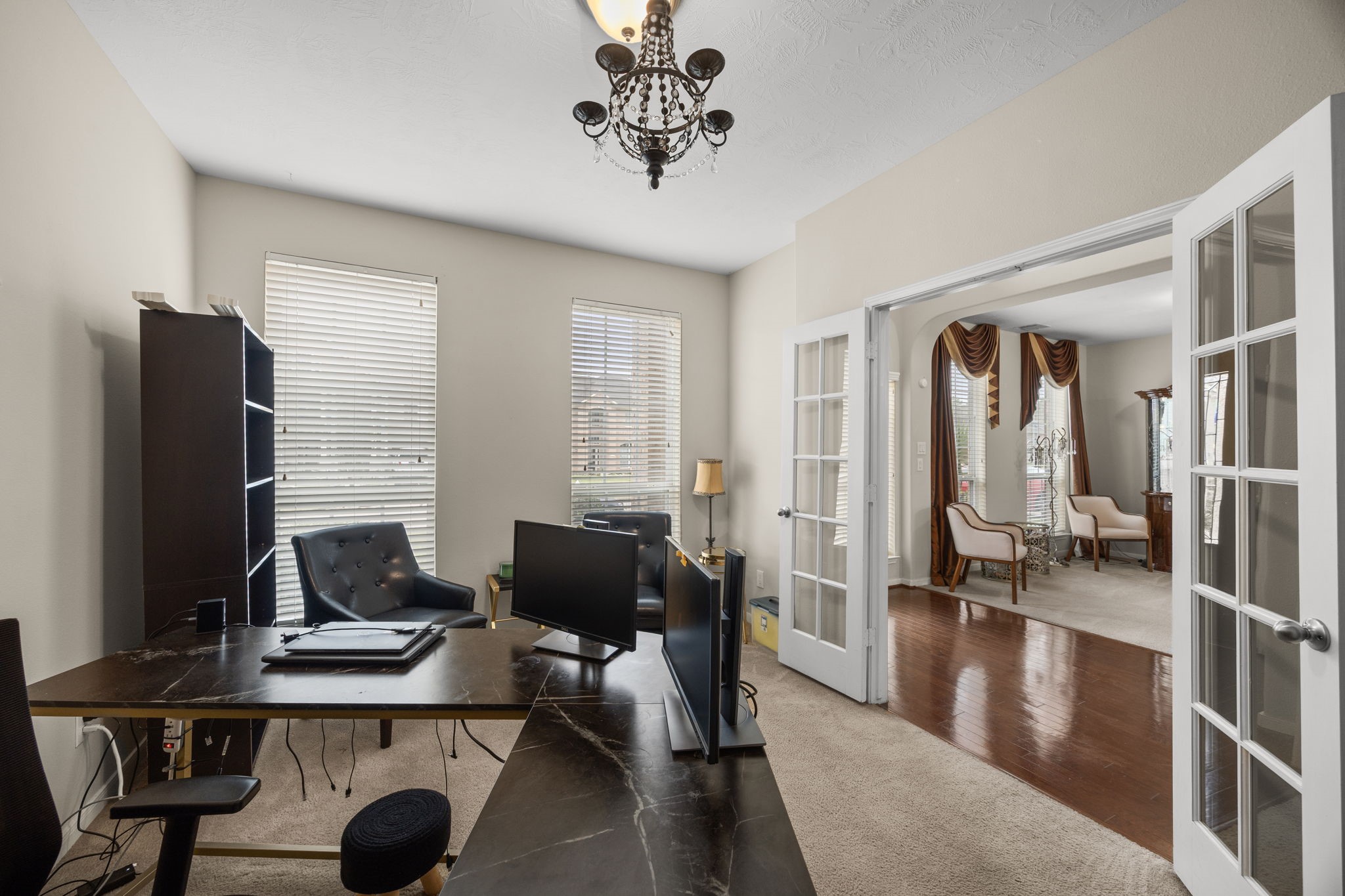 6719 Latchmore Lane Houston, TX 77049 - Photo 22 of 46 a view of a livingroom with workspace and a couch