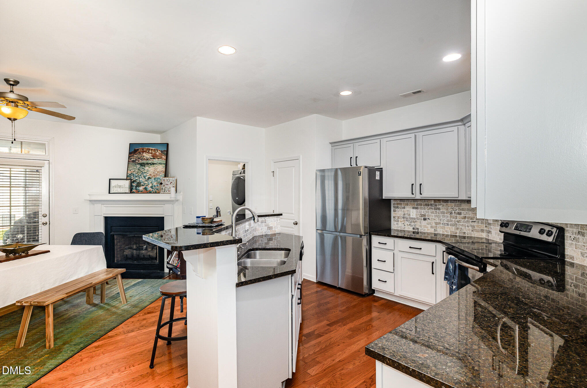 513 Dragby Lane Raleigh, NC 27603 - Photo 11 of 30 a kitchen with refrigerator and cabinets