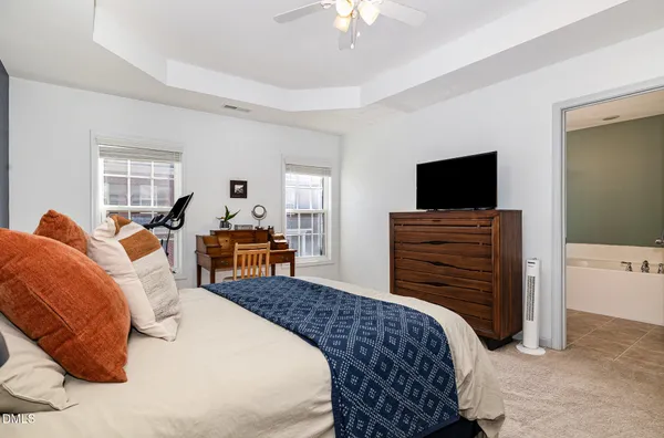 a bed room with furniture and a chandelier