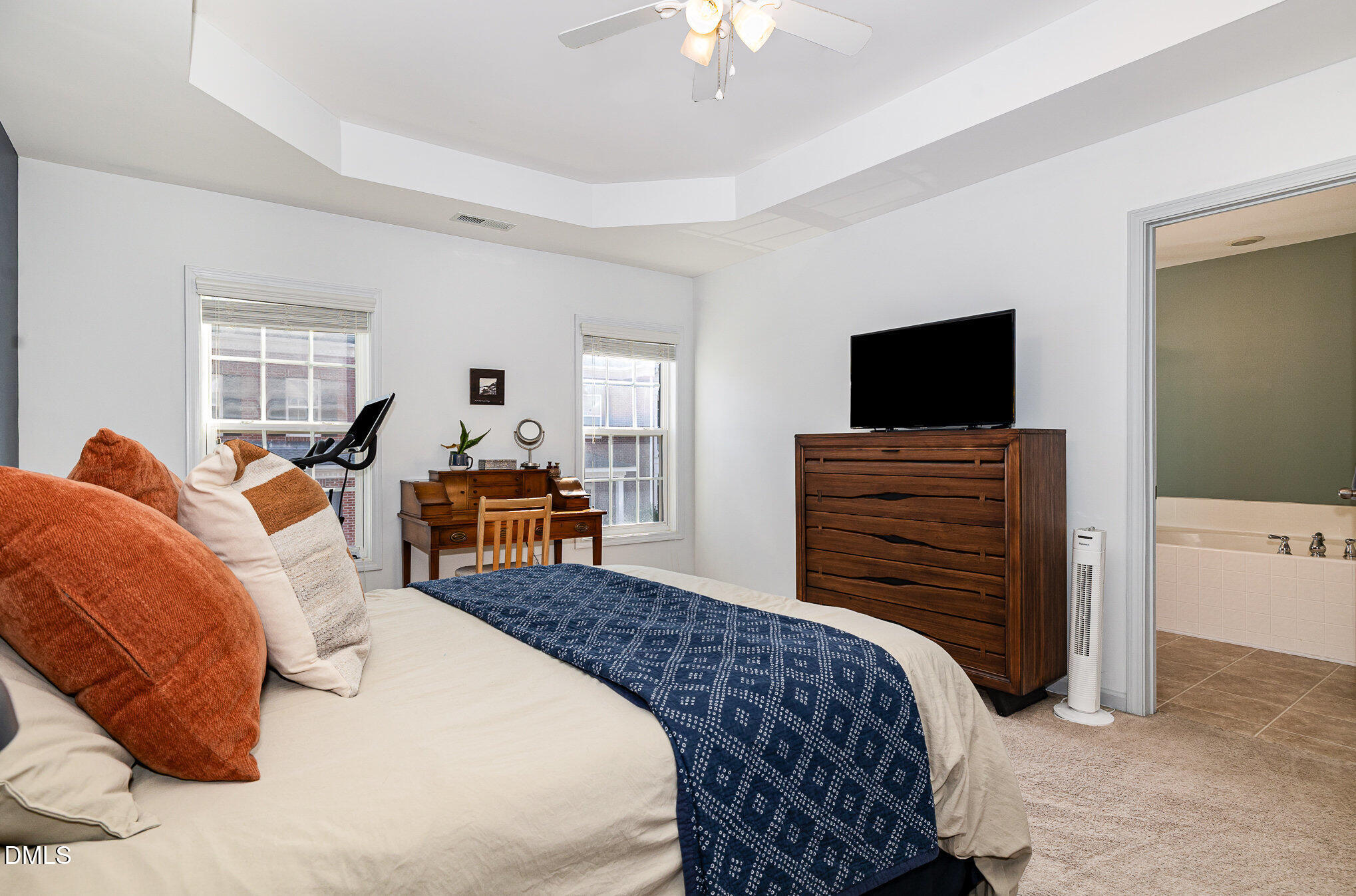 513 Dragby Lane Raleigh, NC 27603 - Photo 15 of 30 a bedroom with a bed and flat screen tv