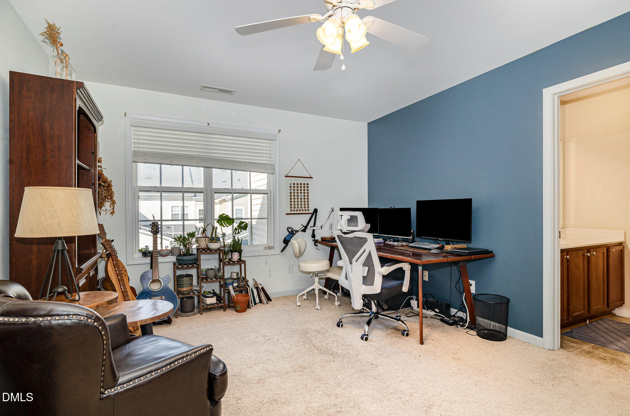 513 Dragby Lane Raleigh, NC 27603 - Photo 18 of 30 a view of a workspace with furniture and a window