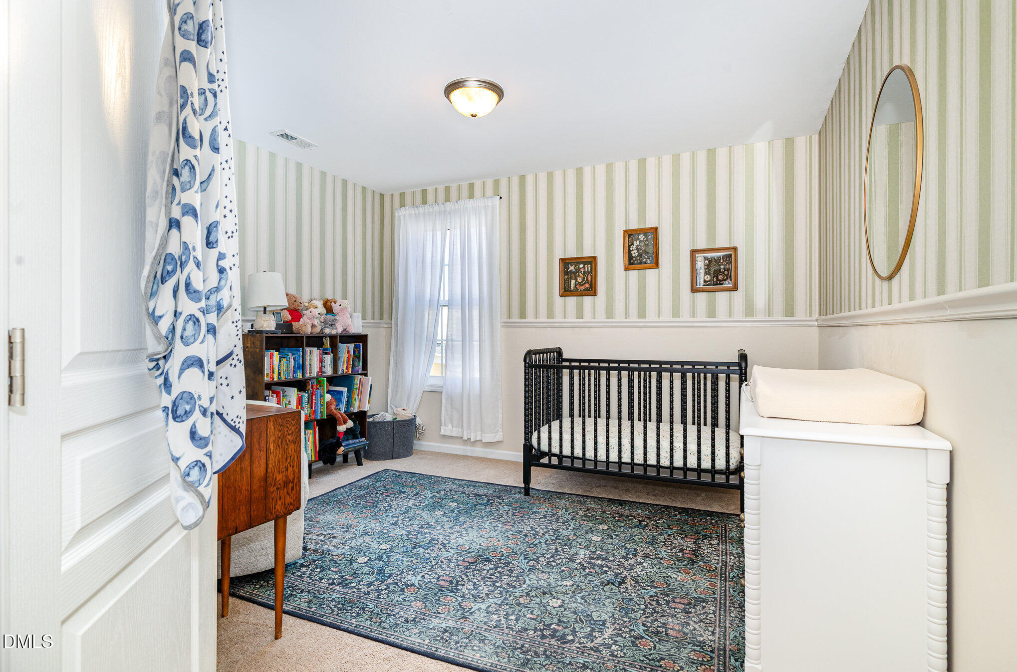 513 Dragby Lane Raleigh, NC 27603 - Photo 20 of 30 a view of a bedroom with baby crib and furniture