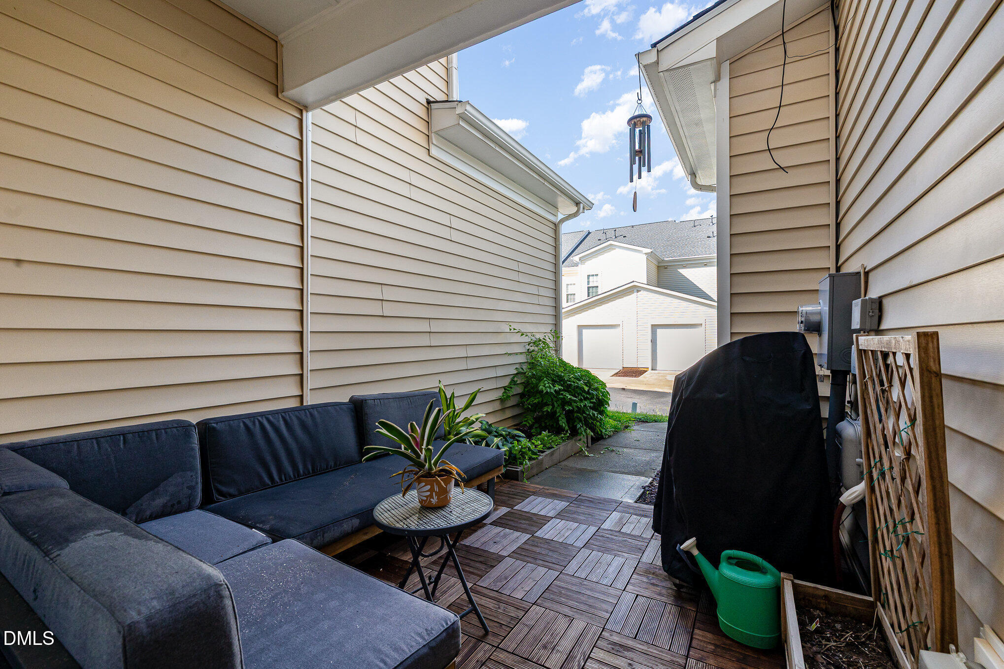 513 Dragby Lane Raleigh, NC 27603 - Photo 25 of 30 a backyard of a house with barbeque oven and potted plants