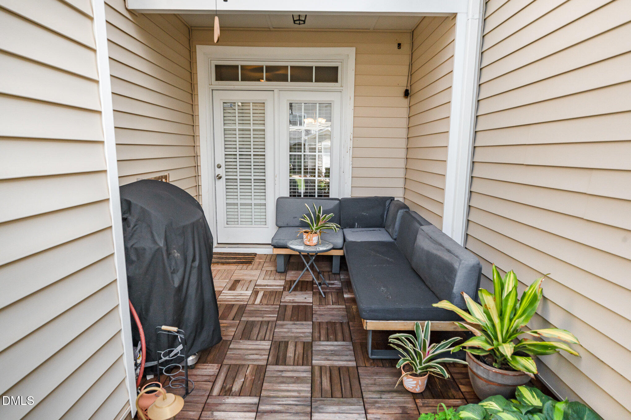 513 Dragby Lane Raleigh, NC 27603 - Photo 27 of 30 a view of balcony with chairs and potted plant