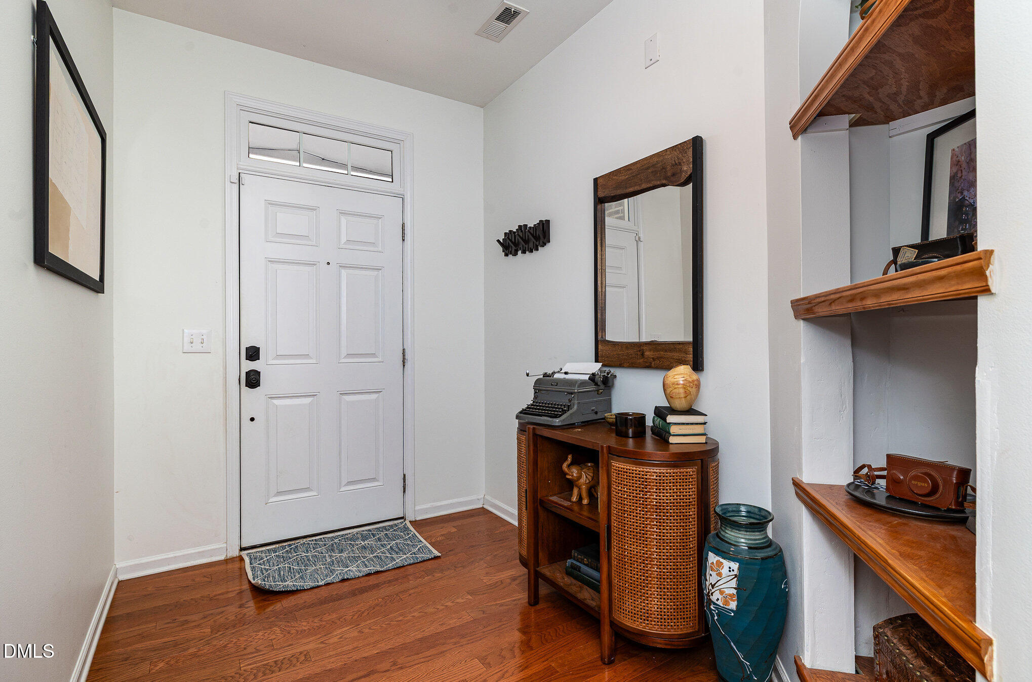 513 Dragby Lane Raleigh, NC 27603 - Photo 5 of 30 a view of a livingroom with workspace and a window