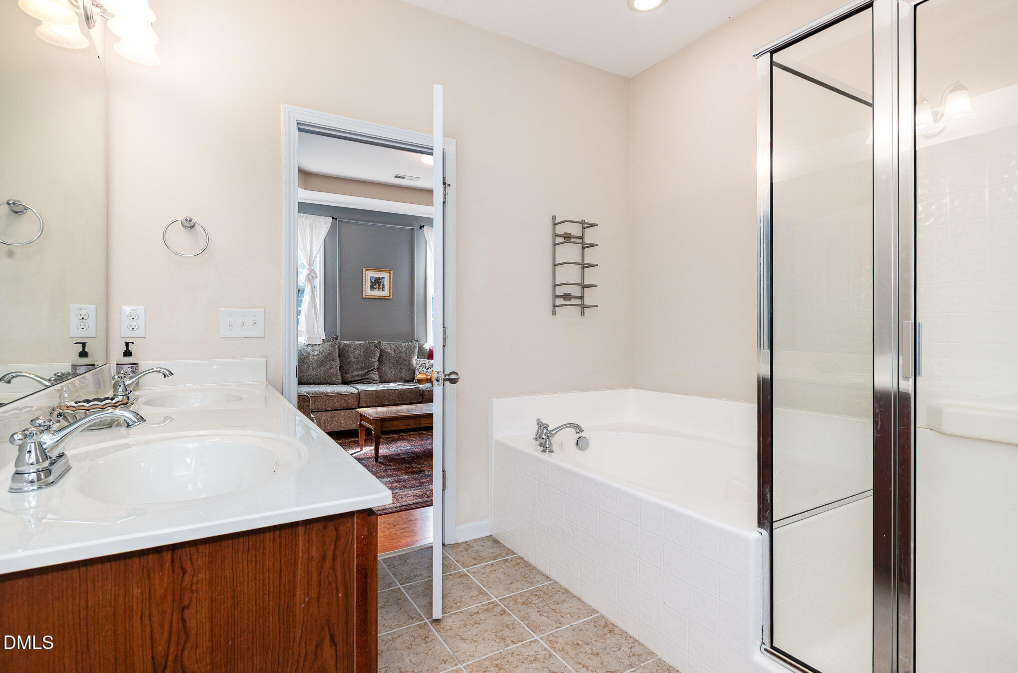 513 Dragby Lane Raleigh, NC 27603 - Photo 8 of 30 a bathroom with a tub sink and mirror