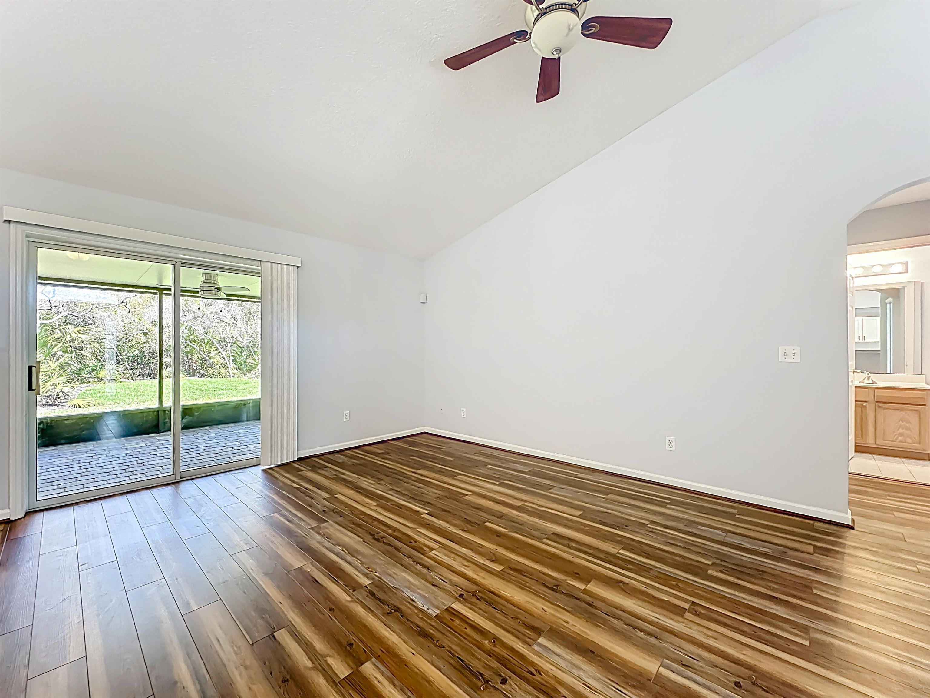 200 Merida Road St. Augustine, FL 32086 - Photo 12 of 66 wooden floor in an empty room with a window