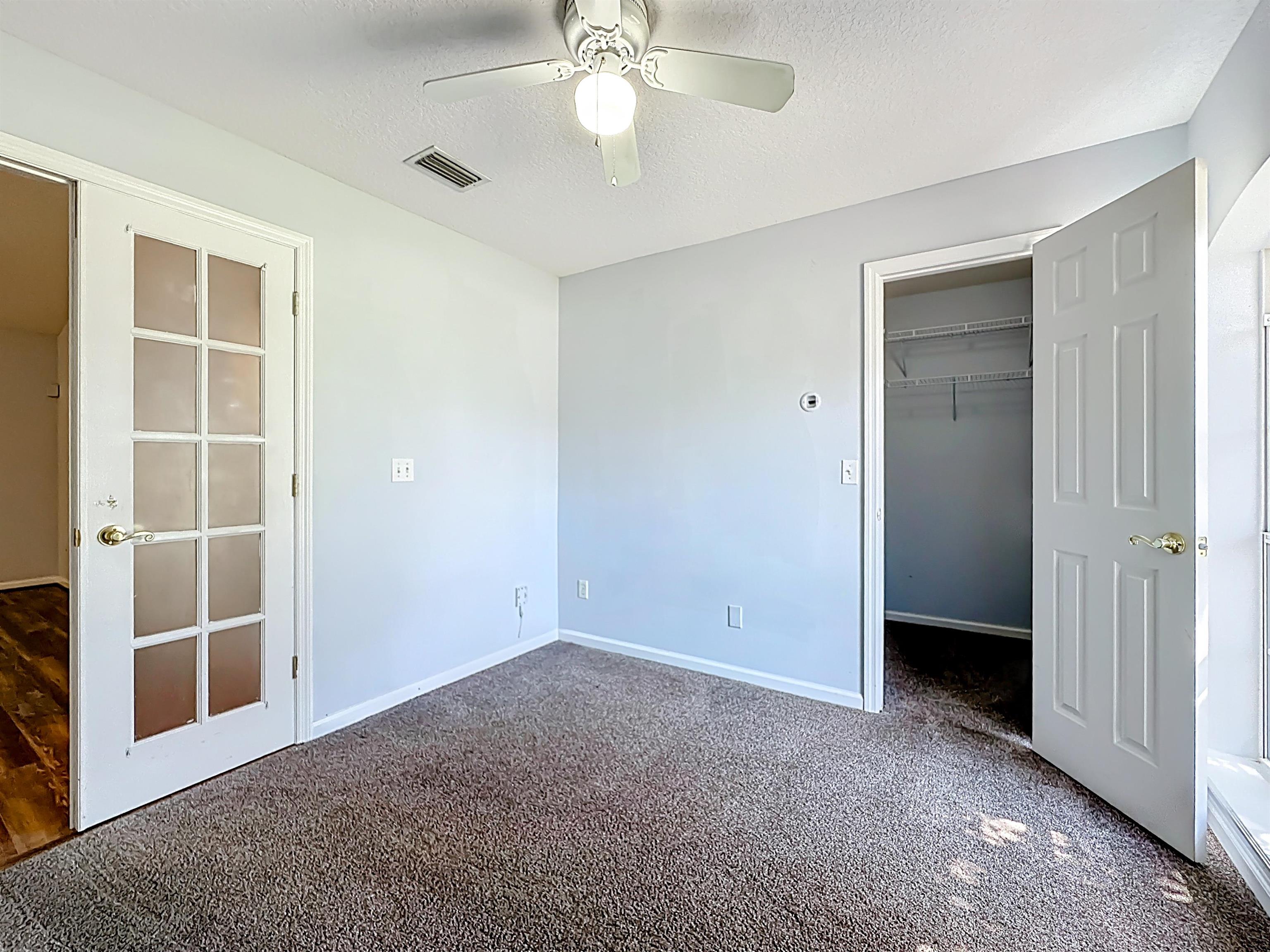 200 Merida Road St. Augustine, FL 32086 - Photo 18 of 66 a view of an empty room with a cabinet and entryway