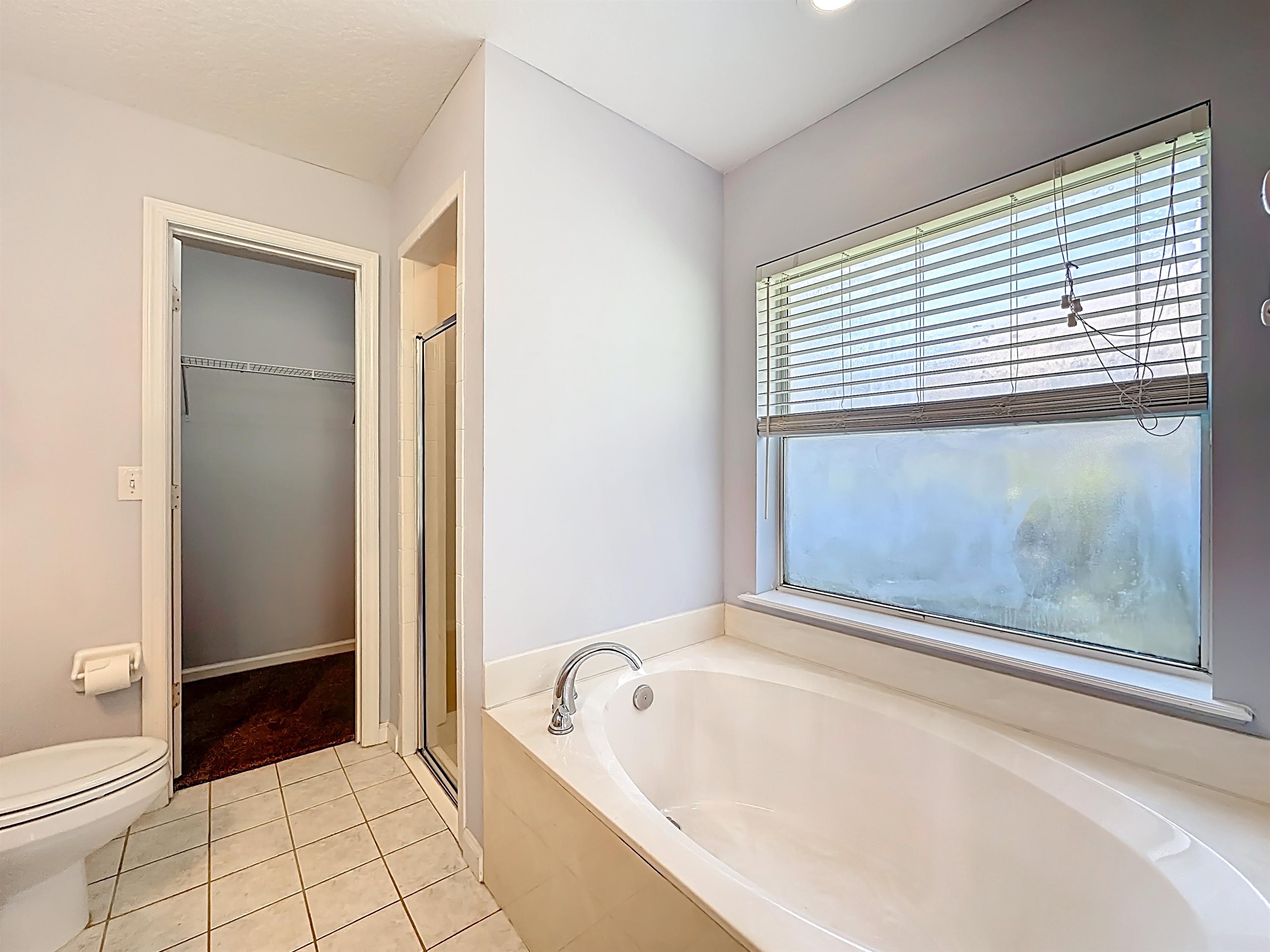 200 Merida Road St. Augustine, FL 32086 - Photo 30 of 66 a bathroom with a bathtub and a shower