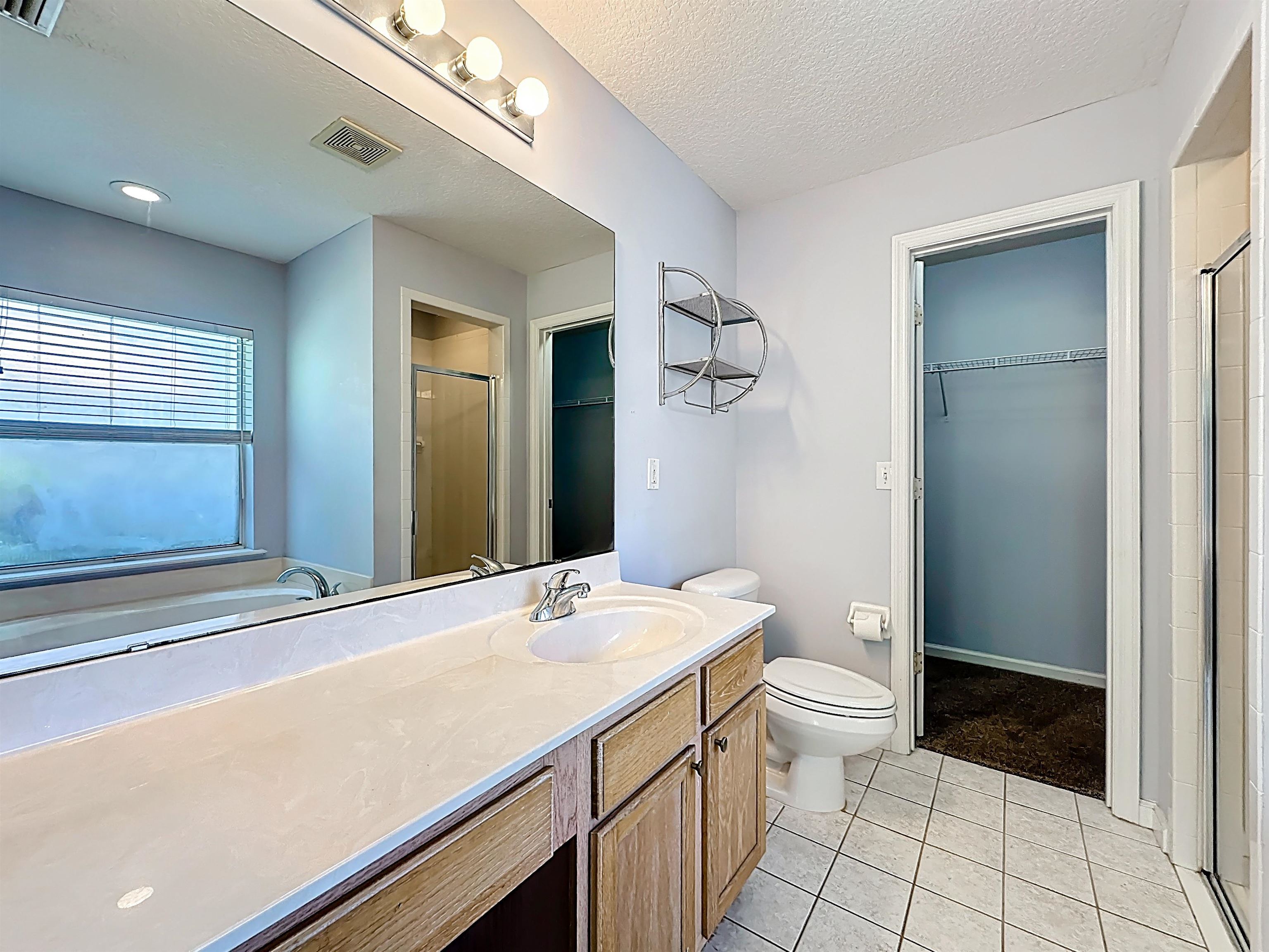 200 Merida Road St. Augustine, FL 32086 - Photo 31 of 66 a bathroom with a sink a toilet and shower