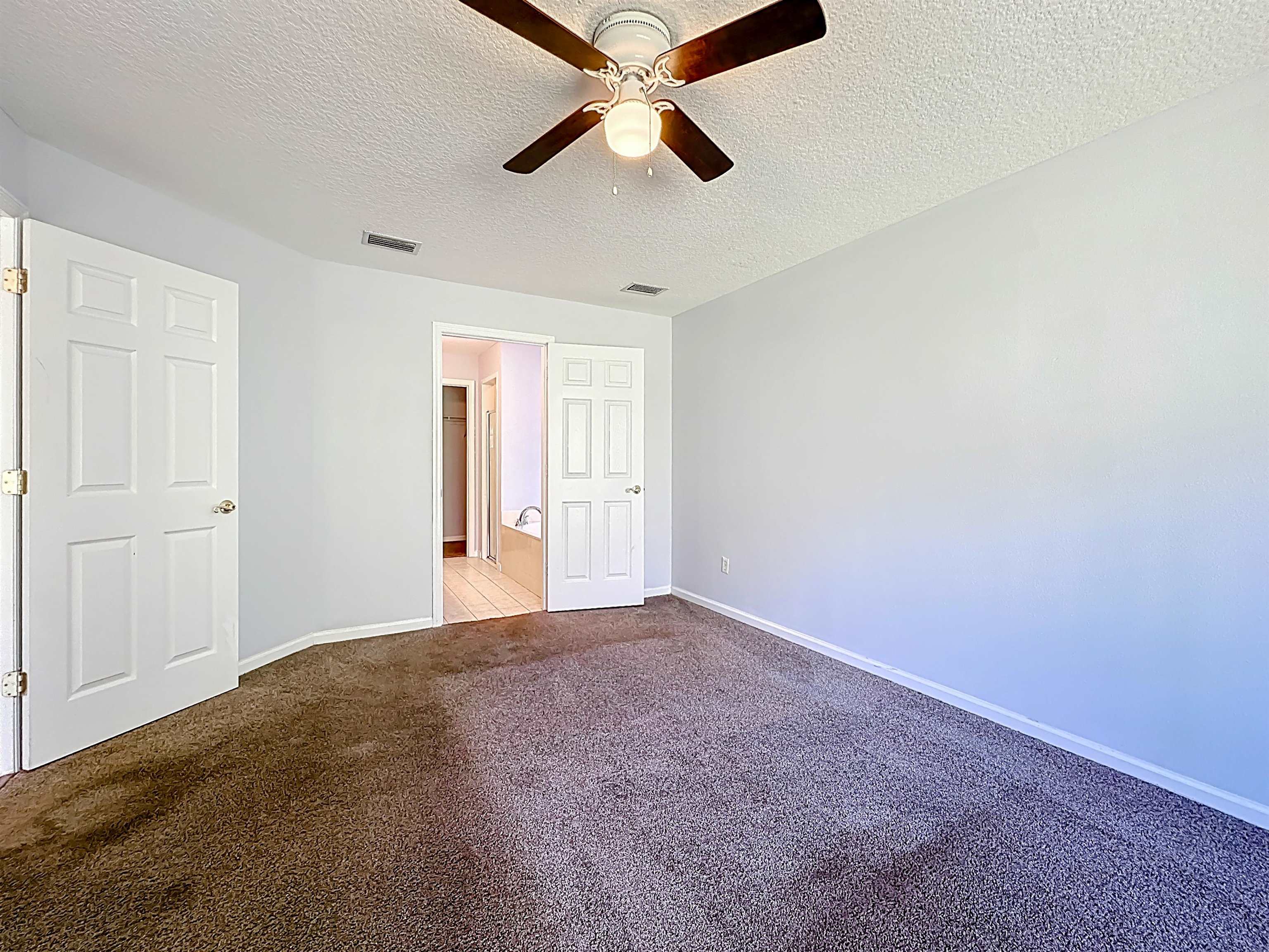 200 Merida Road St. Augustine, FL 32086 - Photo 33 of 66 an empty room with chandelier fan