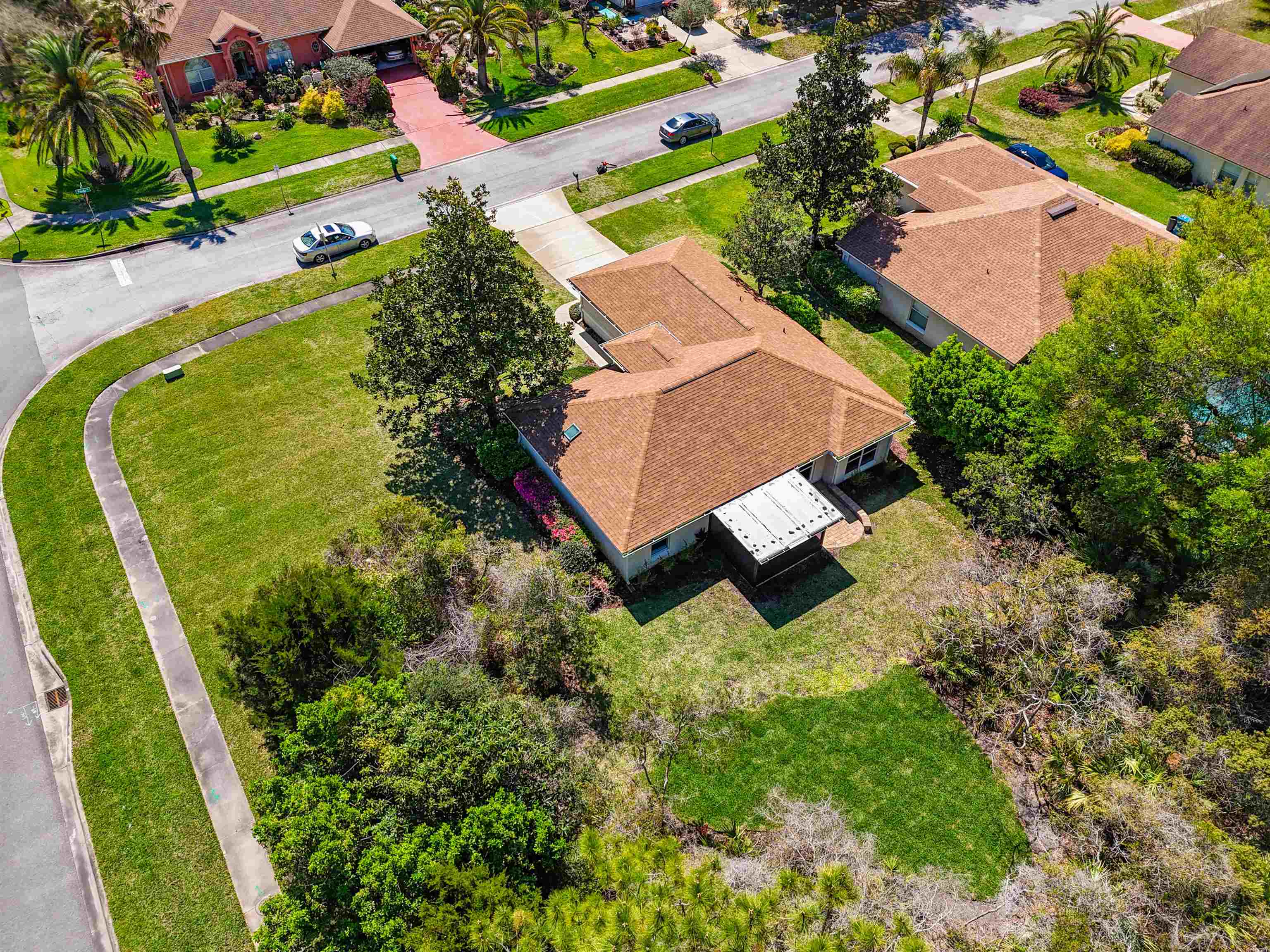 200 Merida Road St. Augustine, FL 32086 - Photo 52 of 66 an aerial view of a house with a garden and swimming pool