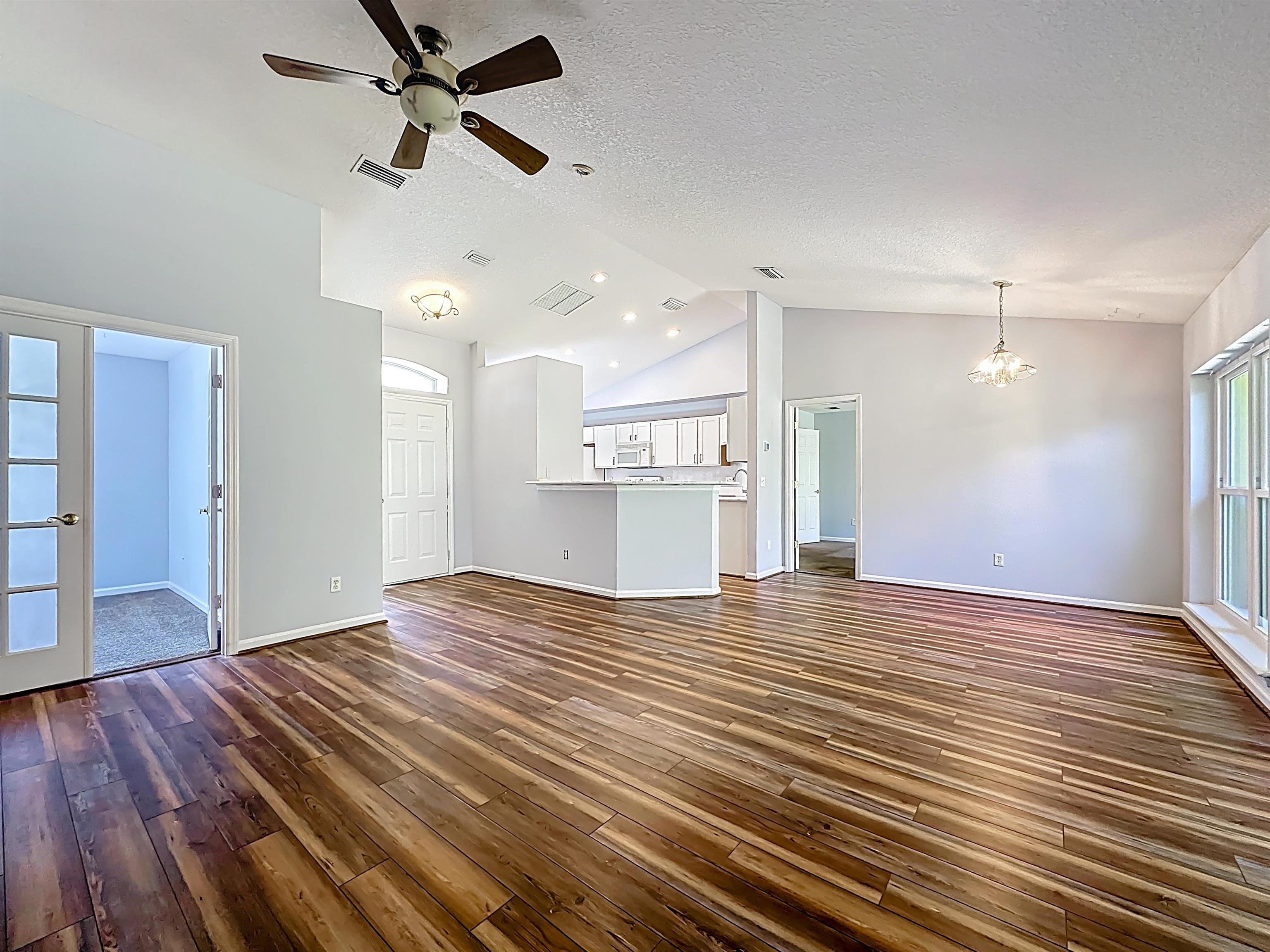 200 Merida Road St. Augustine, FL 32086 - Photo 10 of 66 a view of a kitchen with a sink and wooden floor