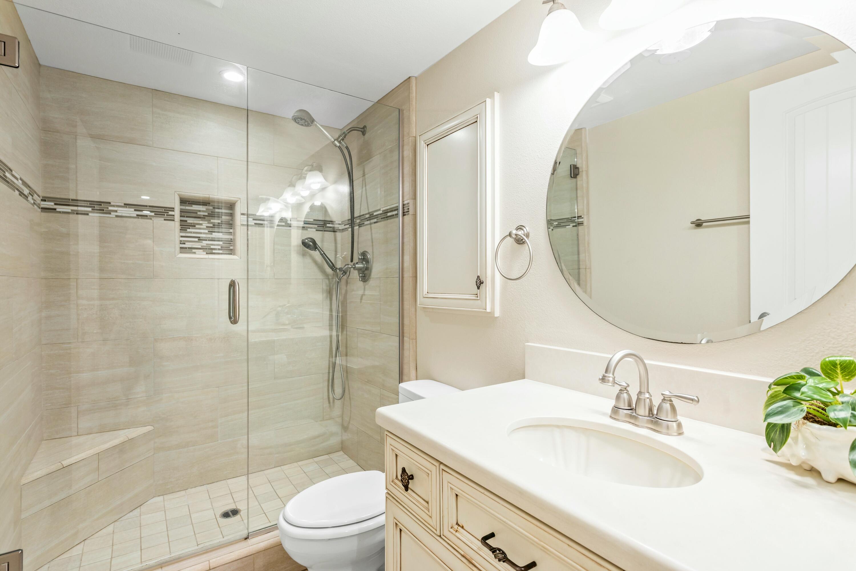 4700 Sandyland Road, Unit 12 Carpinteria, CA 93013 - Photo 12 of 27 a bathroom with a sink toilet and shower