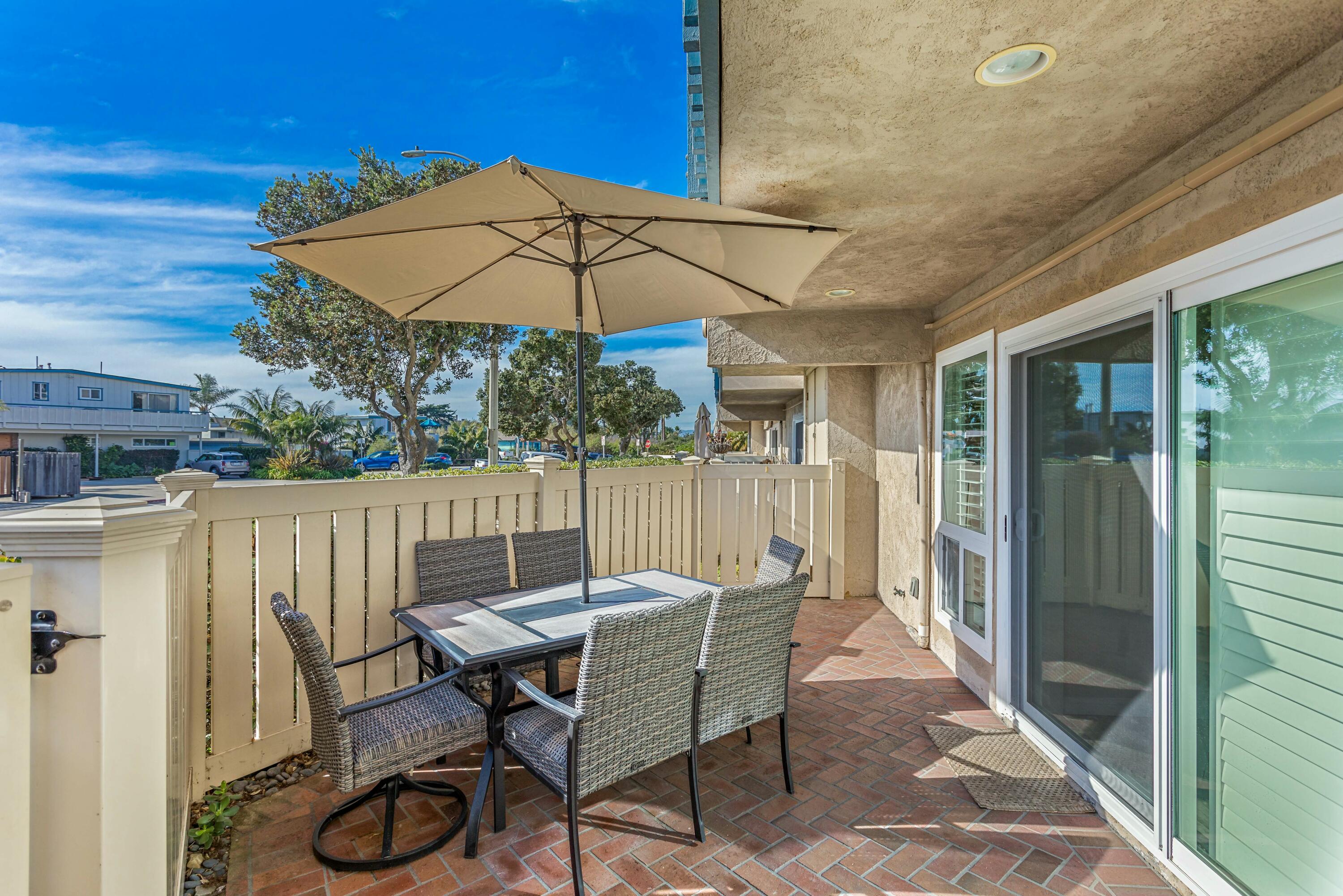 4700 Sandyland Road, Unit 12 Carpinteria, CA 93013 - Photo 13 of 27 a patio with a patio table and chairs