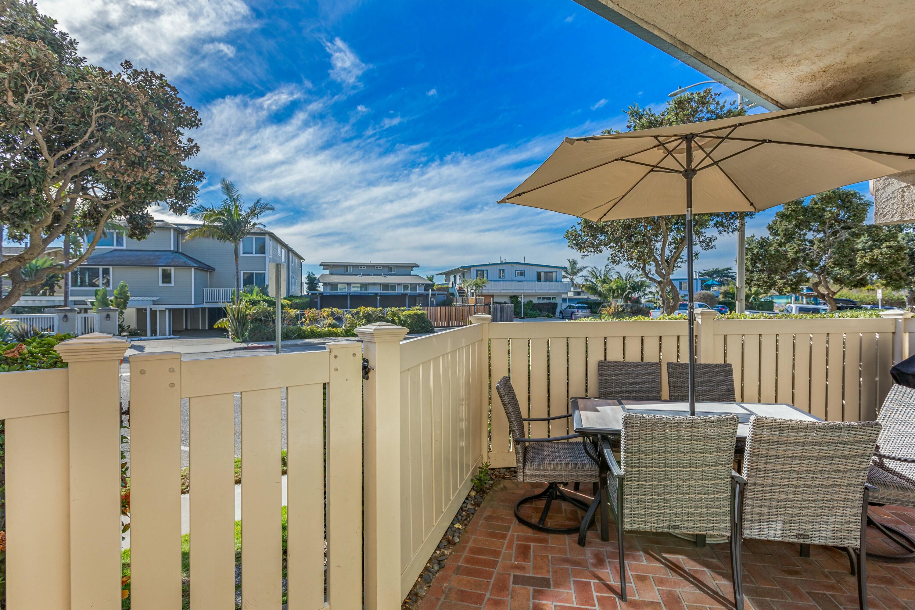 4700 Sandyland Road, Unit 12 Carpinteria, CA 93013 - Photo 14 of 27 a view of balcony with wooden floor and outdoor seating