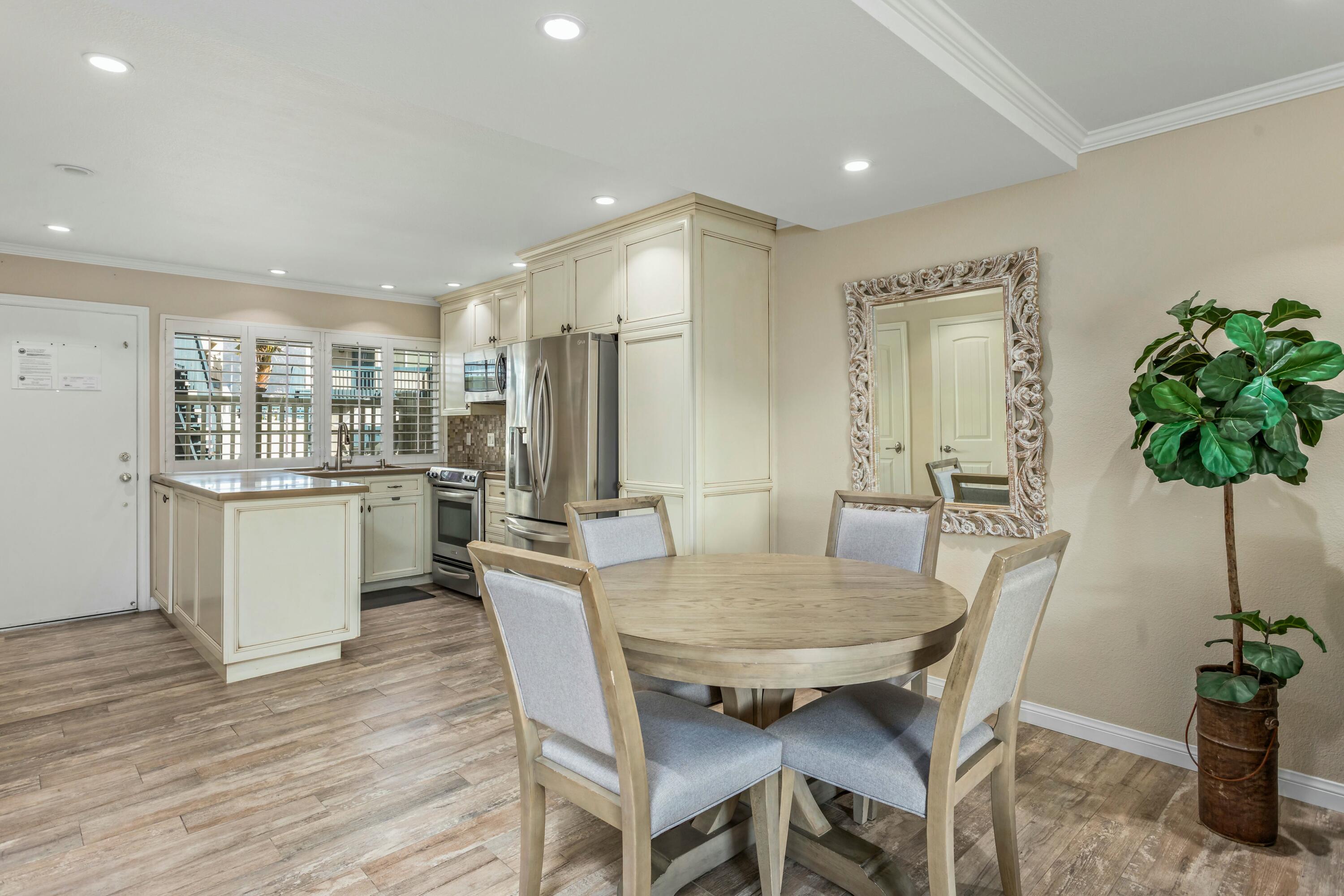 4700 Sandyland Road, Unit 12 Carpinteria, CA 93013 - Photo 5 of 27 a view of a dining room with furniture and a potted plant