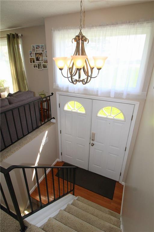 310 Fort Couch Road Pittsburgh, PA 15241 - Photo 2 of 25 Open and bright entryway with hardwood flooring.