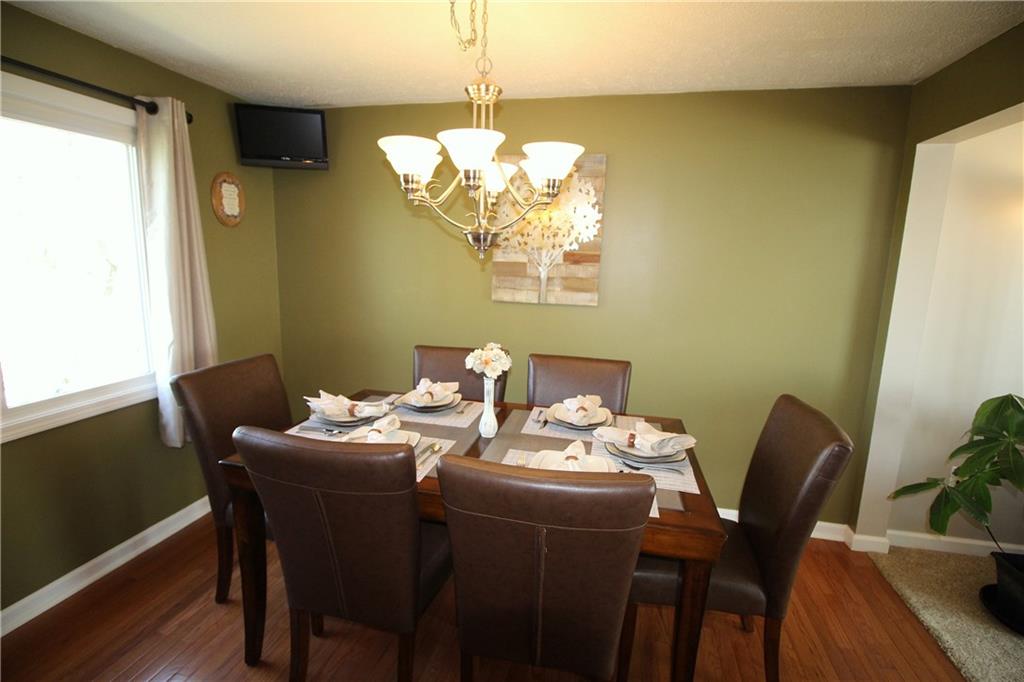 310 Fort Couch Road Pittsburgh, PA 15241 - Photo 7 of 25 Both the kitchen and dining room have hardwood flooring.