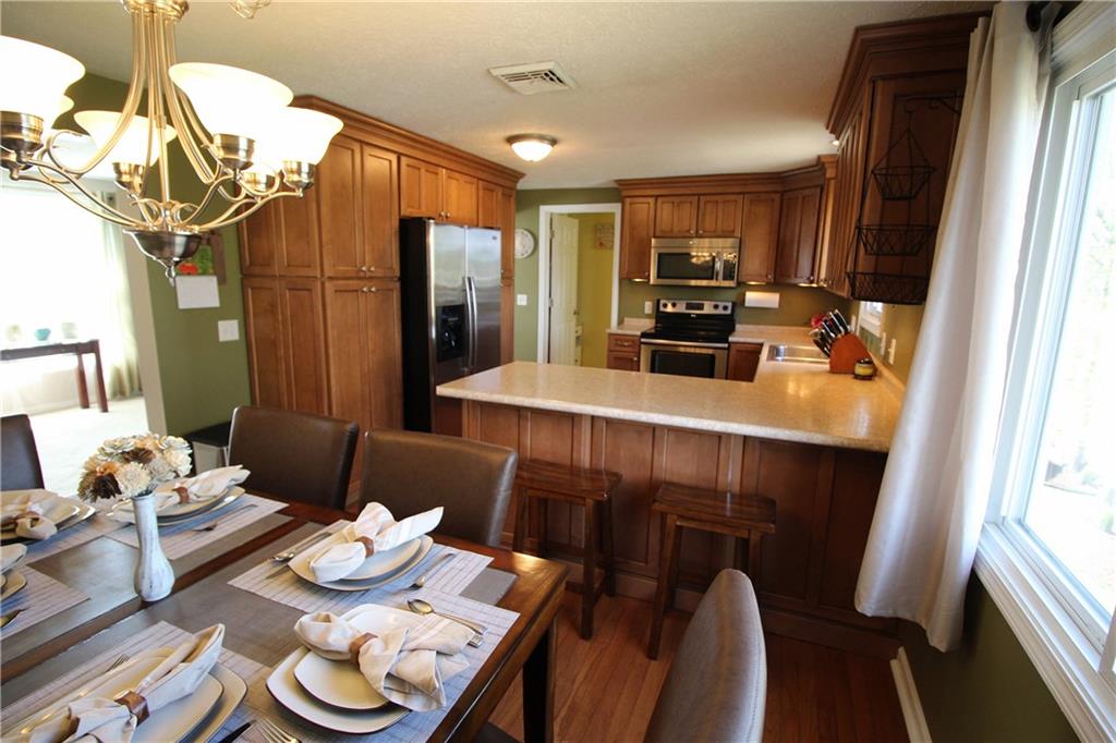 310 Fort Couch Road Pittsburgh, PA 15241 - Photo 8 of 25 Another view of the kitchen and dining room.