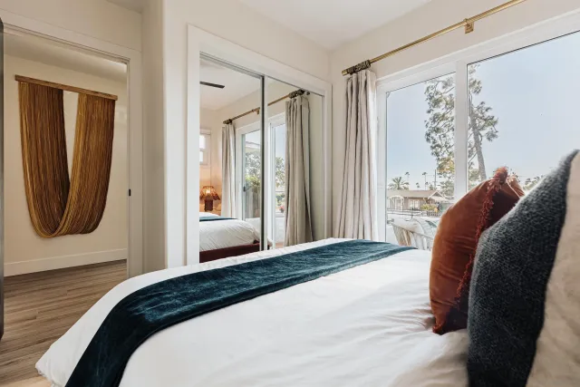 a bedroom with a bed and a lamp