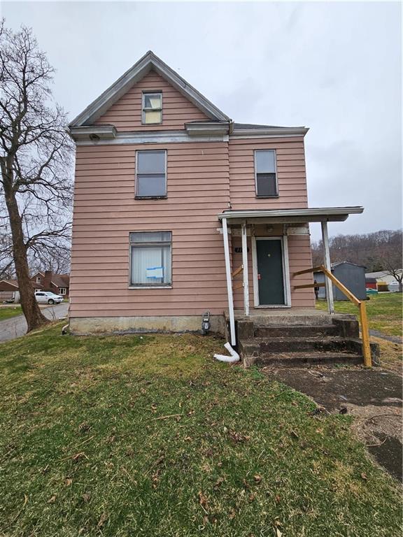 1101 Market Street Beaver, PA 15009 - Photo 1 of 21 a front view of a house with garden