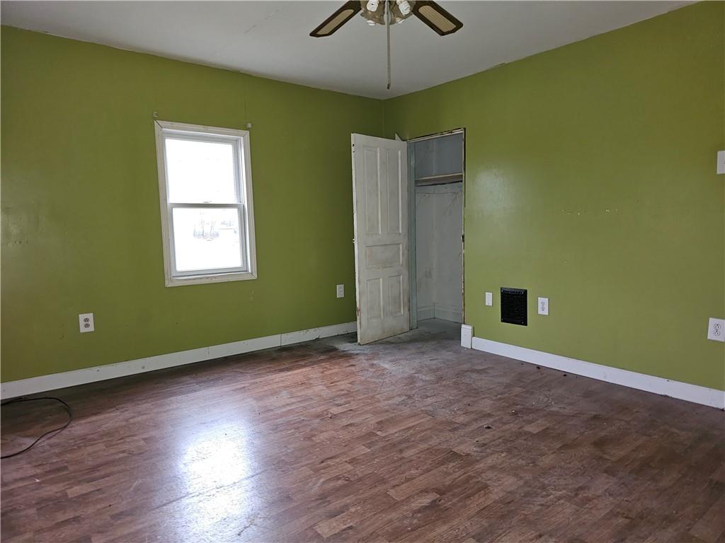 1101 Market Street Beaver, PA 15009 - Photo 11 of 21 a view of an empty room with a window and wooden floor