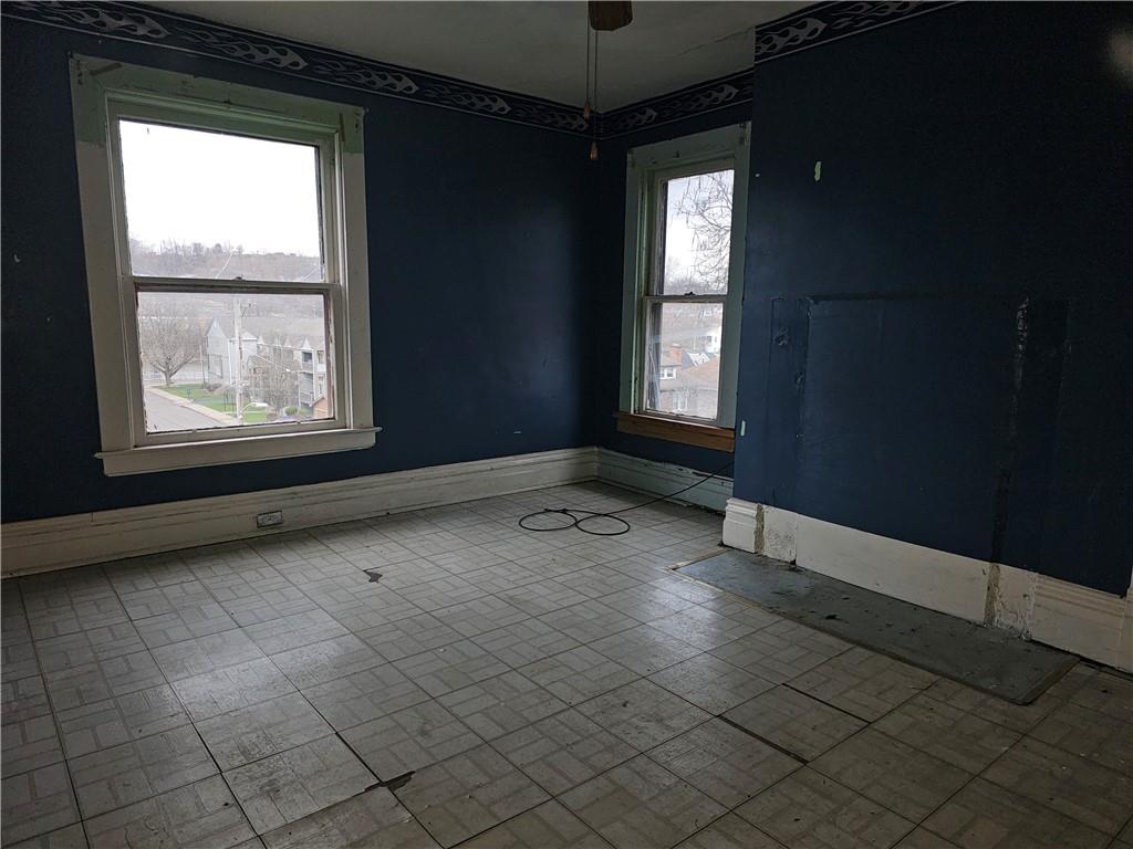 1101 Market Street Beaver, PA 15009 - Photo 14 of 21 an empty room with windows
