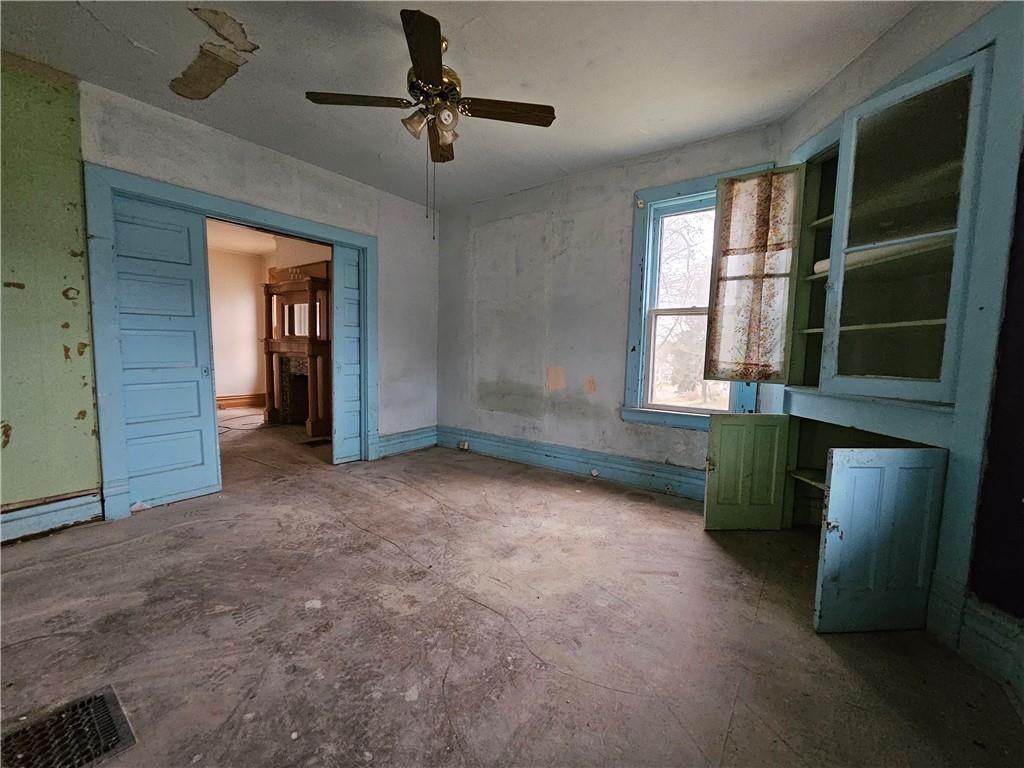 1101 Market Street Beaver, PA 15009 - Photo 8 of 21 an empty room with windows and closet