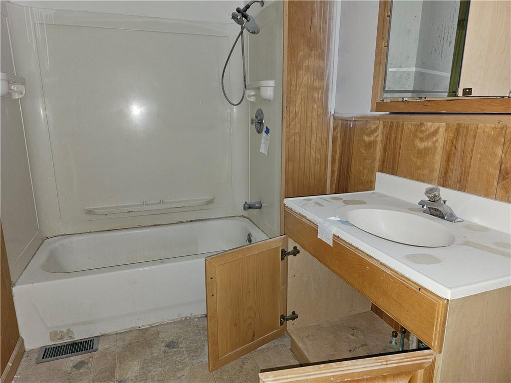 1101 Market Street Beaver, PA 15009 - Photo 9 of 21 a bathroom with a sink and shower