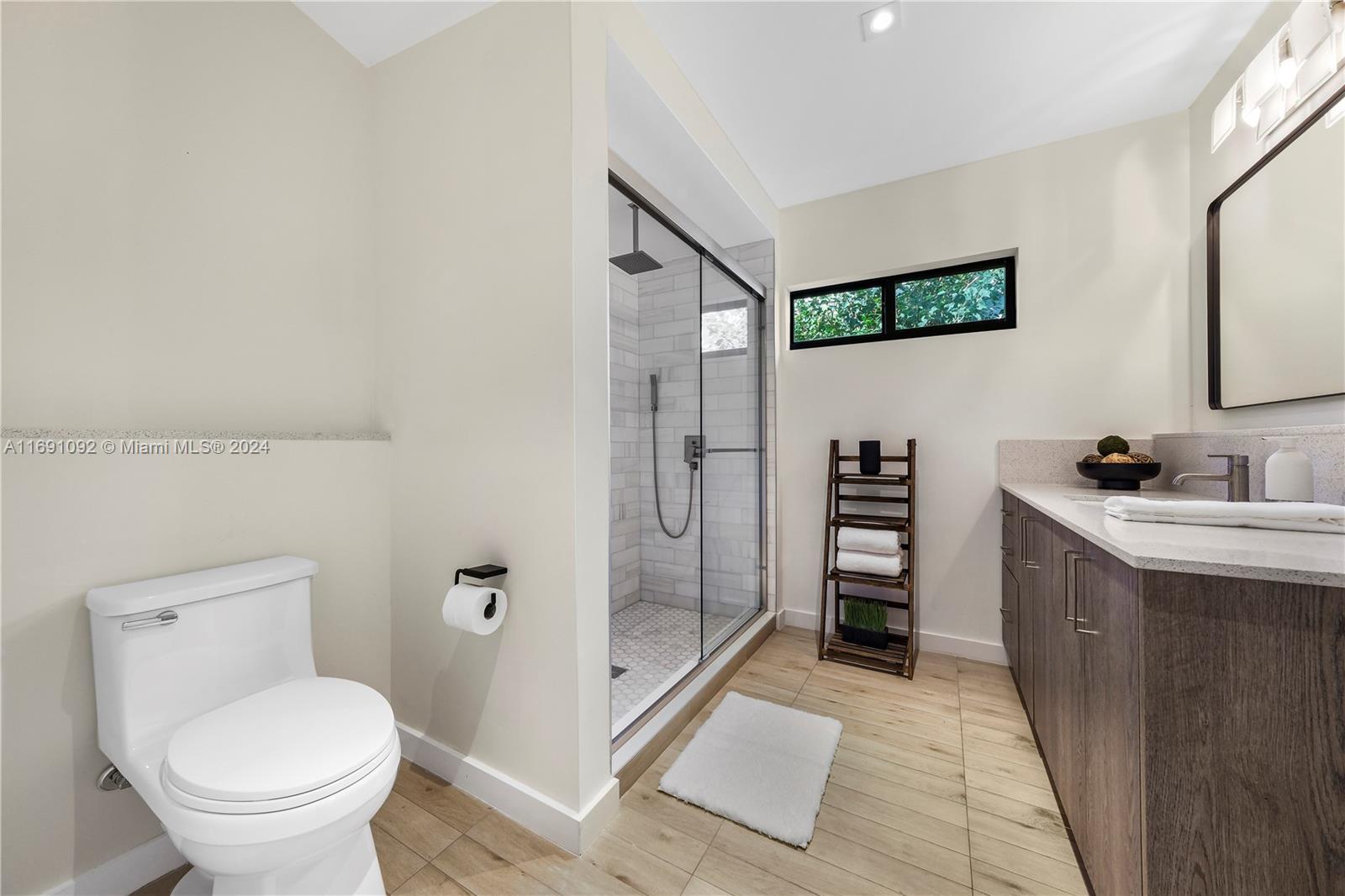 2429 Southwest 25th Terrace Miami, FL 33133 - Photo 11 of 35 a bathroom with a toilet sink and shower