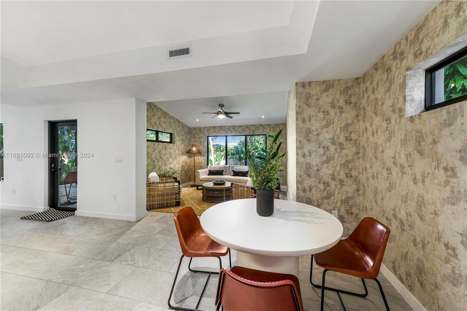 2429 Southwest 25th Terrace Miami, FL 33133 - Photo 16 of 35 a view of a dining room with furniture and a potted plant