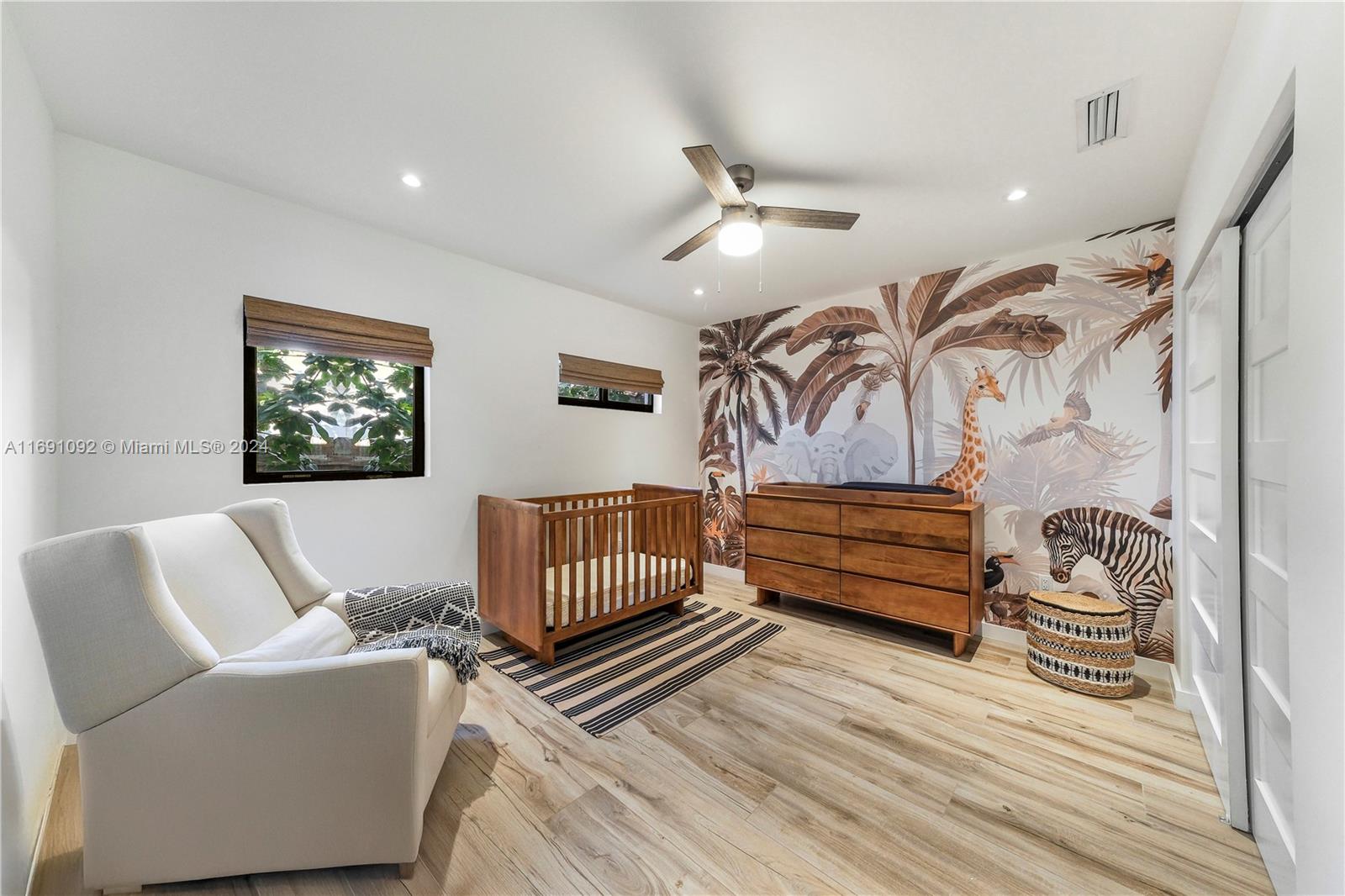 2429 Southwest 25th Terrace Miami, FL 33133 - Photo 28 of 35 a bedroom with furniture and wooden floor