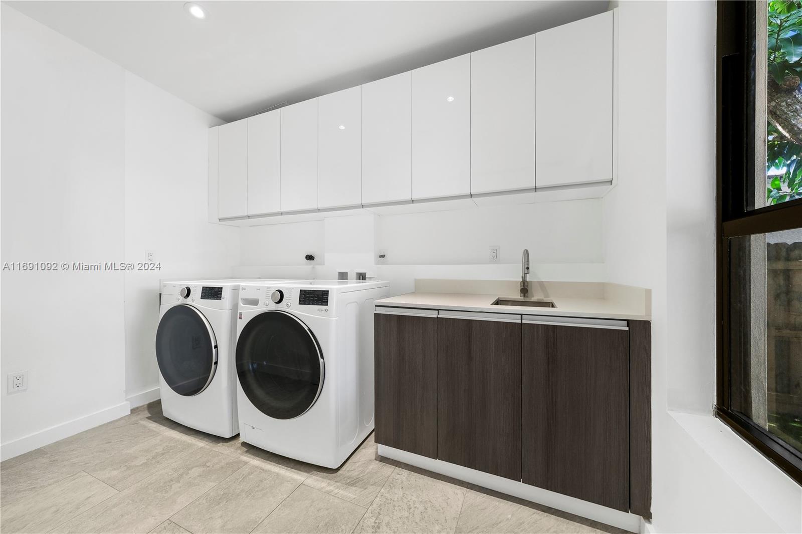 2429 Southwest 25th Terrace Miami, FL 33133 - Photo 29 of 35 a utility room with dryer and washer