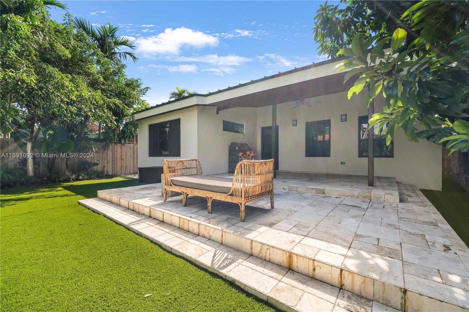 2429 Southwest 25th Terrace Miami, FL 33133 - Photo 30 of 35 a view of a house with backyard and a tree