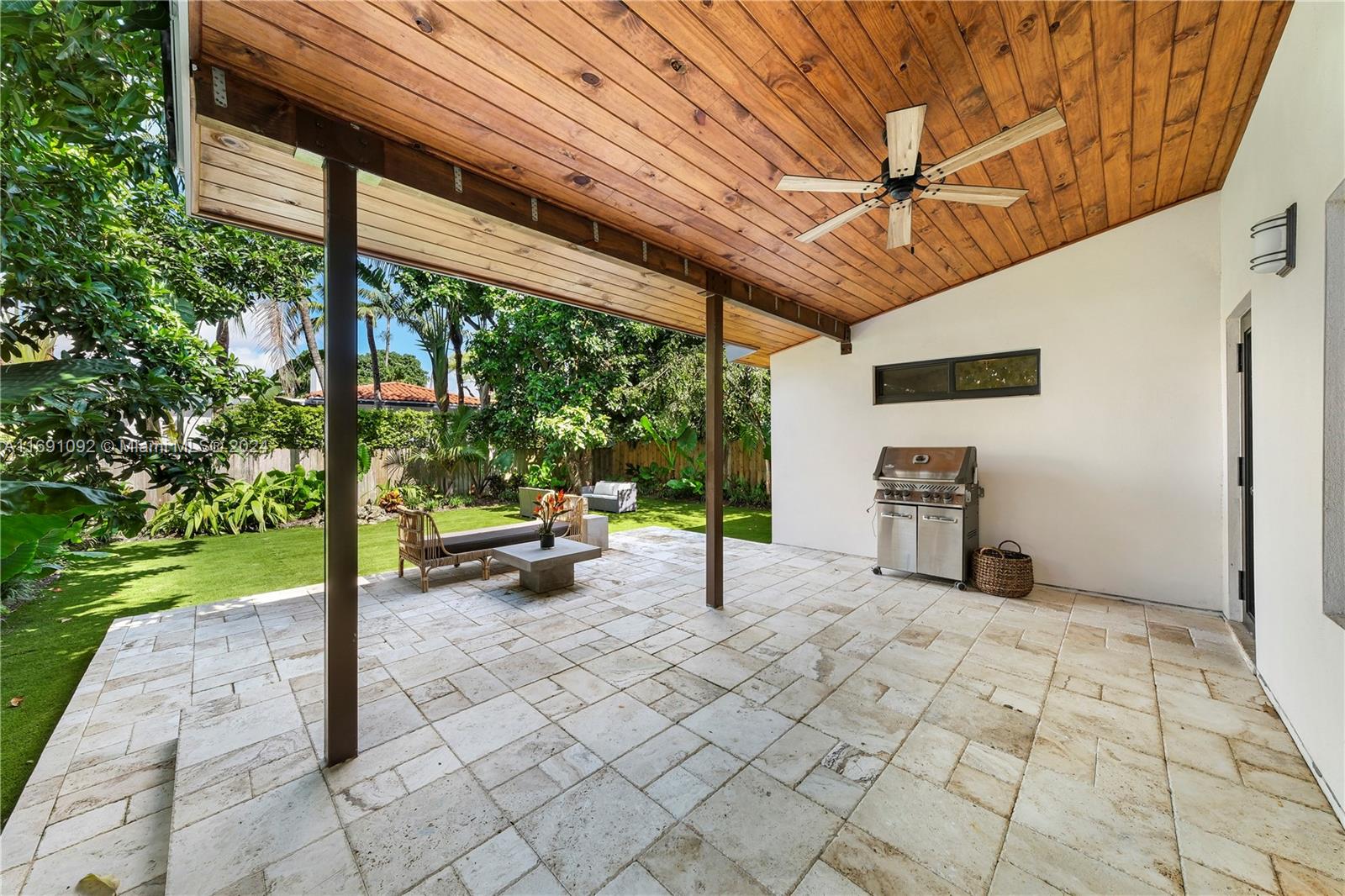 2429 Southwest 25th Terrace Miami, FL 33133 - Photo 32 of 35 a view of a porch with chairs and a yard