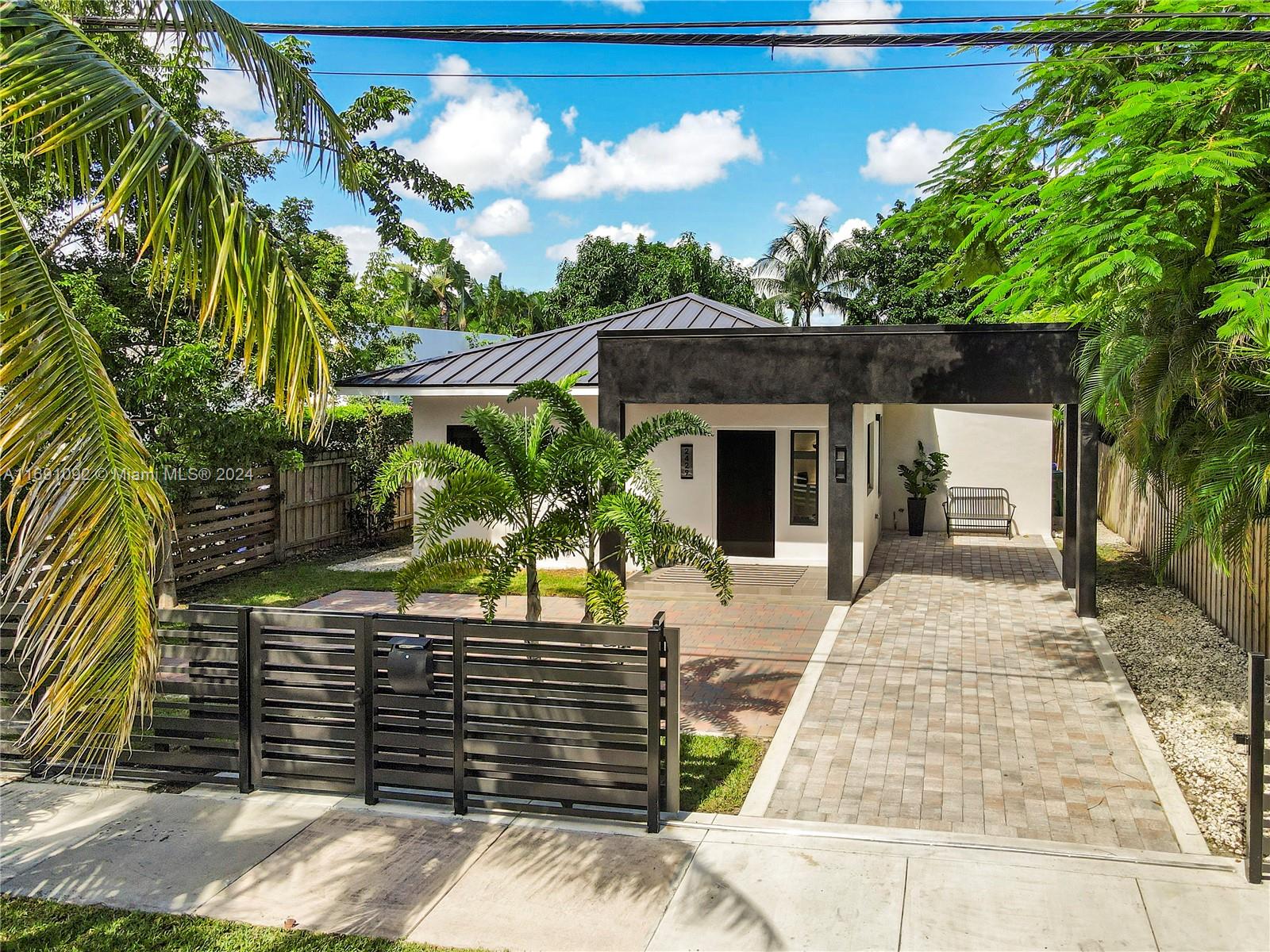 2429 Southwest 25th Terrace Miami, FL 33133 - Photo 33 of 35 a front view of a house with garden