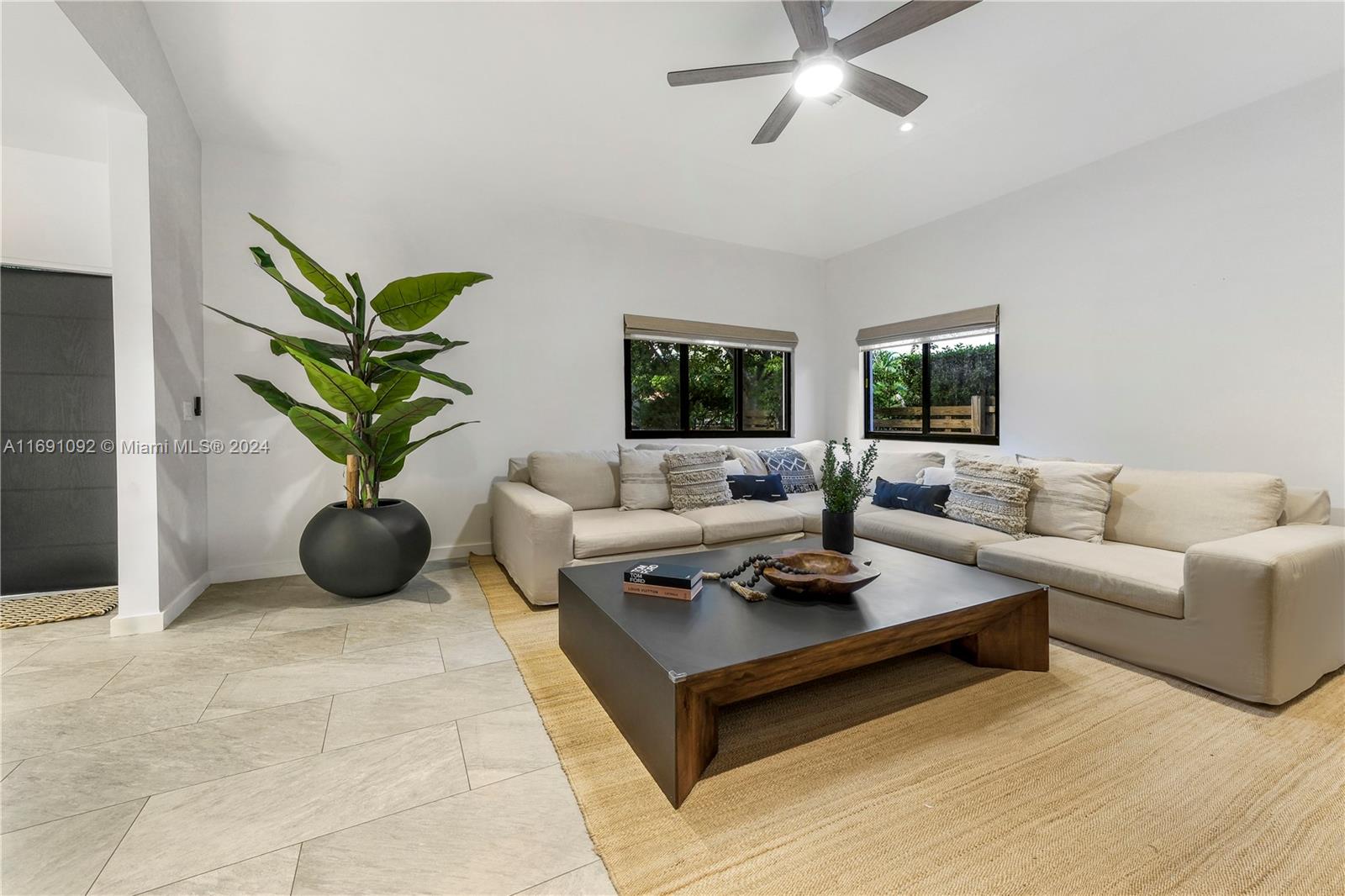 2429 Southwest 25th Terrace Miami, FL 33133 - Photo 6 of 35 a living room with furniture potted plant and a window