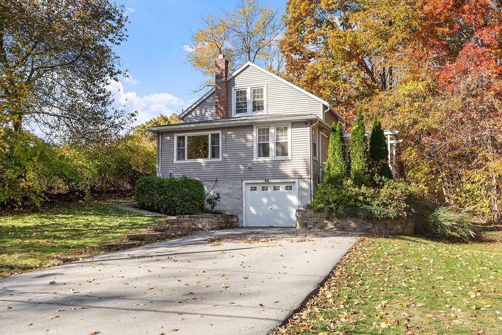 66 Dawson Road Worcester, MA 01602 - Photo 1 of 40 a front view of a house with a yard