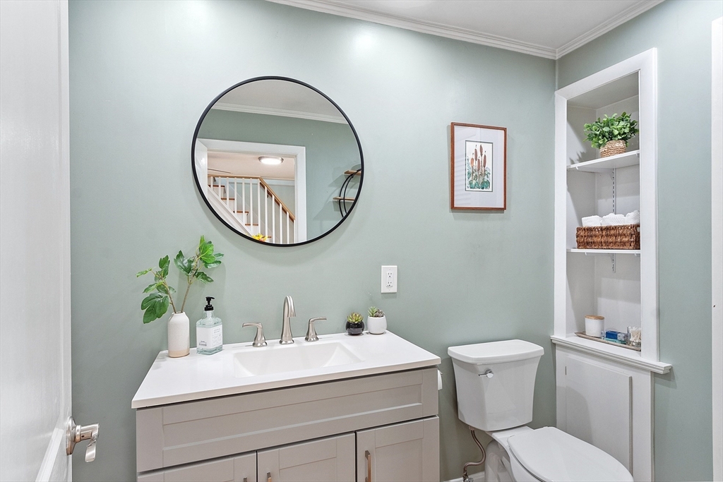 66 Dawson Road Worcester, MA 01602 - Photo 19 of 40 a bathroom with a toilet a sink and a mirror