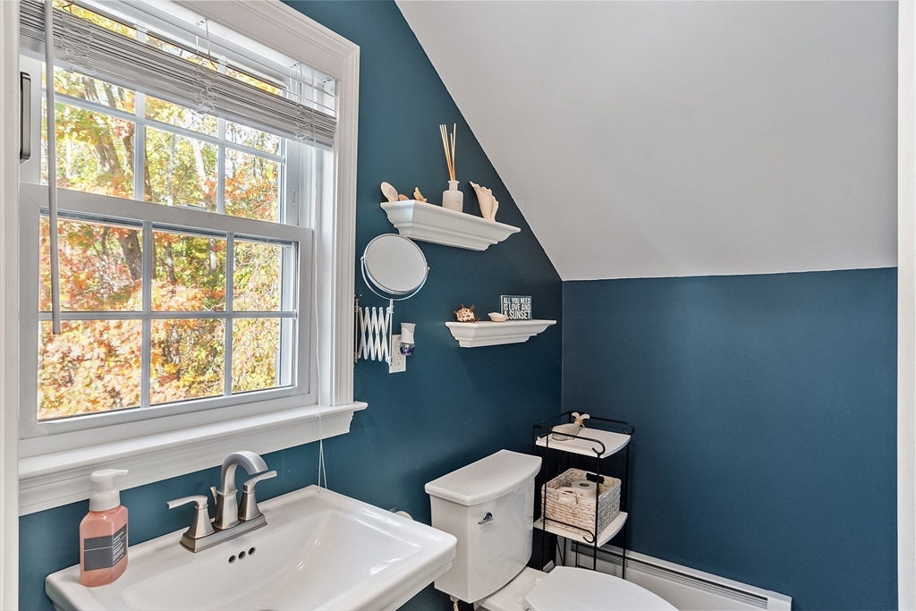 66 Dawson Road Worcester, MA 01602 - Photo 26 of 40 a bathroom with a toilet sink and mirror