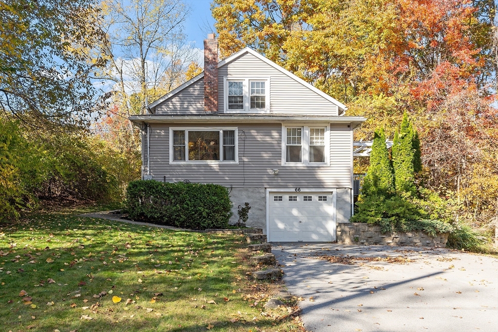 66 Dawson Road Worcester, MA 01602 - Photo 27 of 40 a front view of a house with a yard garage and outdoor seating