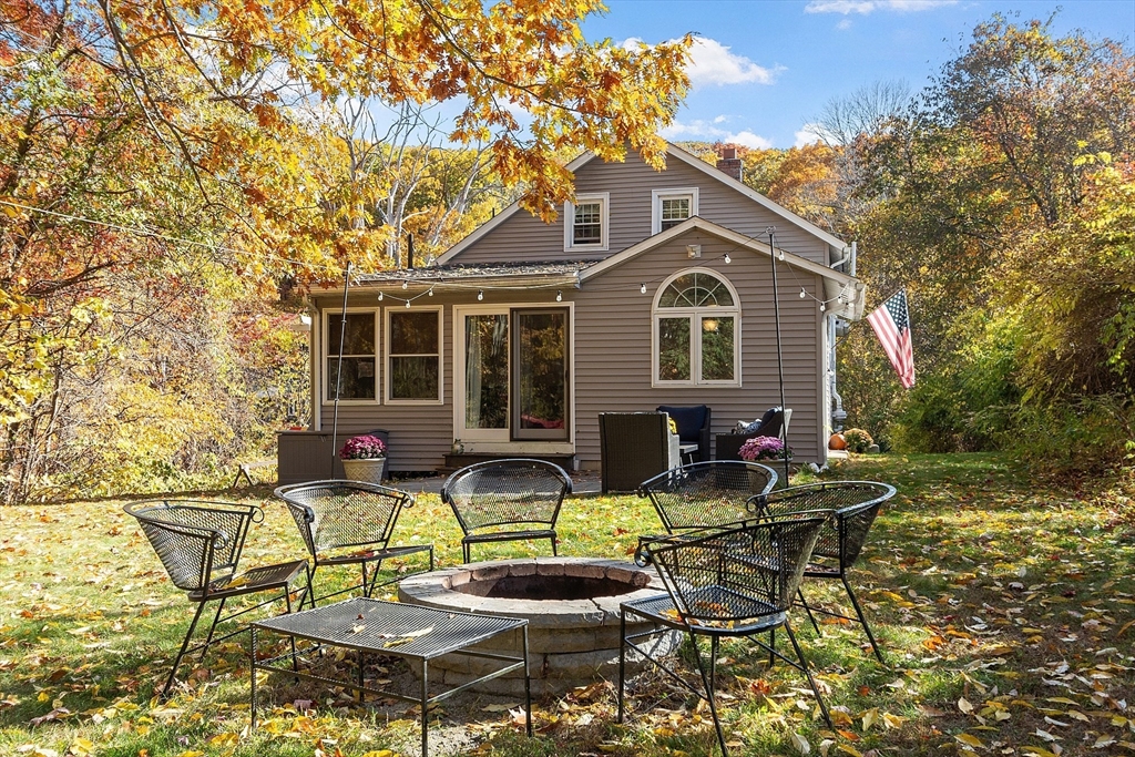 66 Dawson Road Worcester, MA 01602 - Photo 33 of 40 a view of a house with backyard sitting area and garden