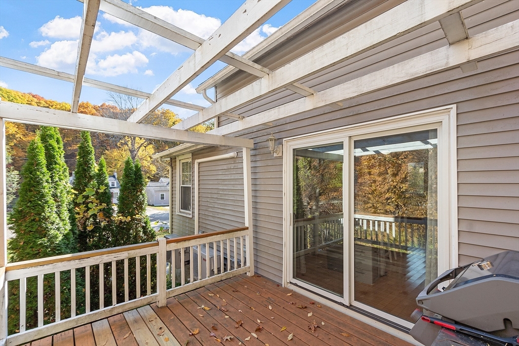66 Dawson Road Worcester, MA 01602 - Photo 39 of 40 a view of a porch with wooden floor and outside view