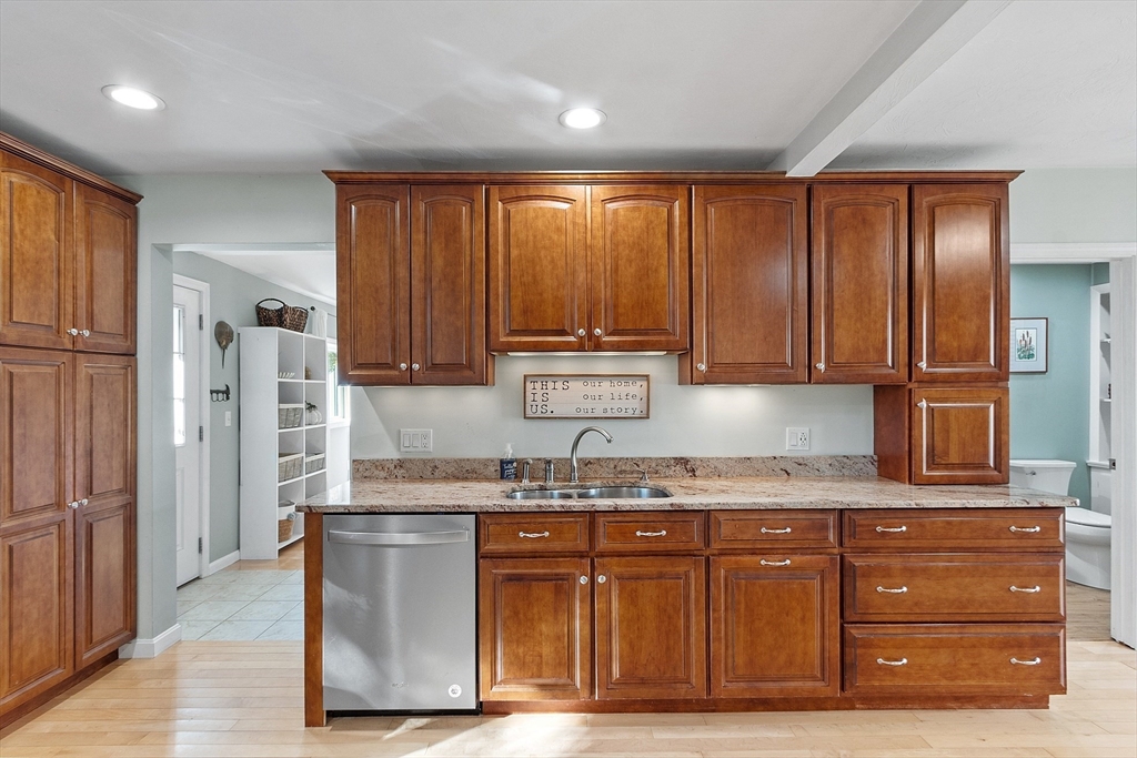 66 Dawson Road Worcester, MA 01602 - Photo 8 of 40 a kitchen with granite countertop wooden cabinets and stainless steel appliances
