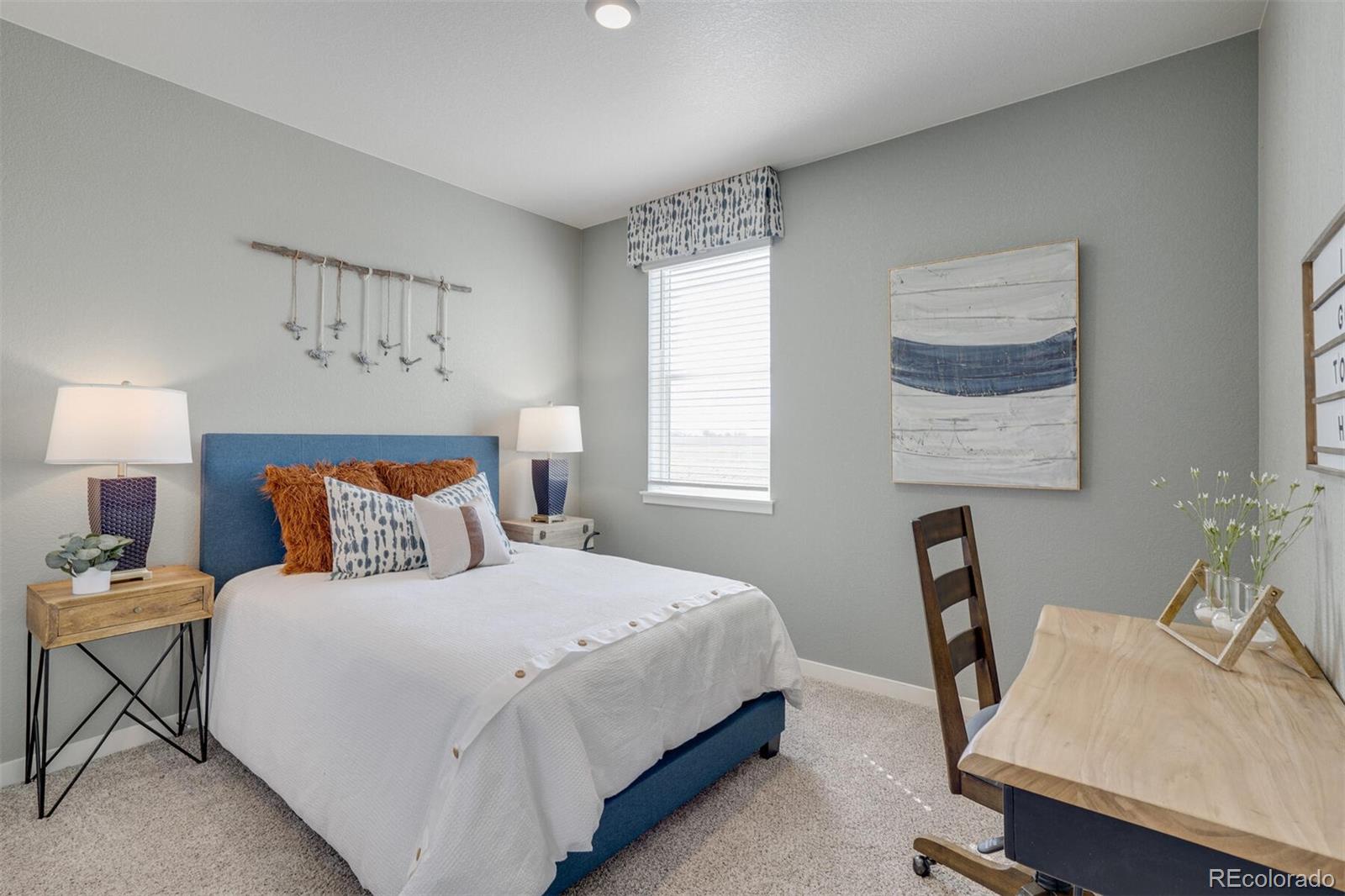 4202 Sandstone Drive Mead, CO 80504 - Photo 7 of 18 a bedroom with a bed a desk and chair
