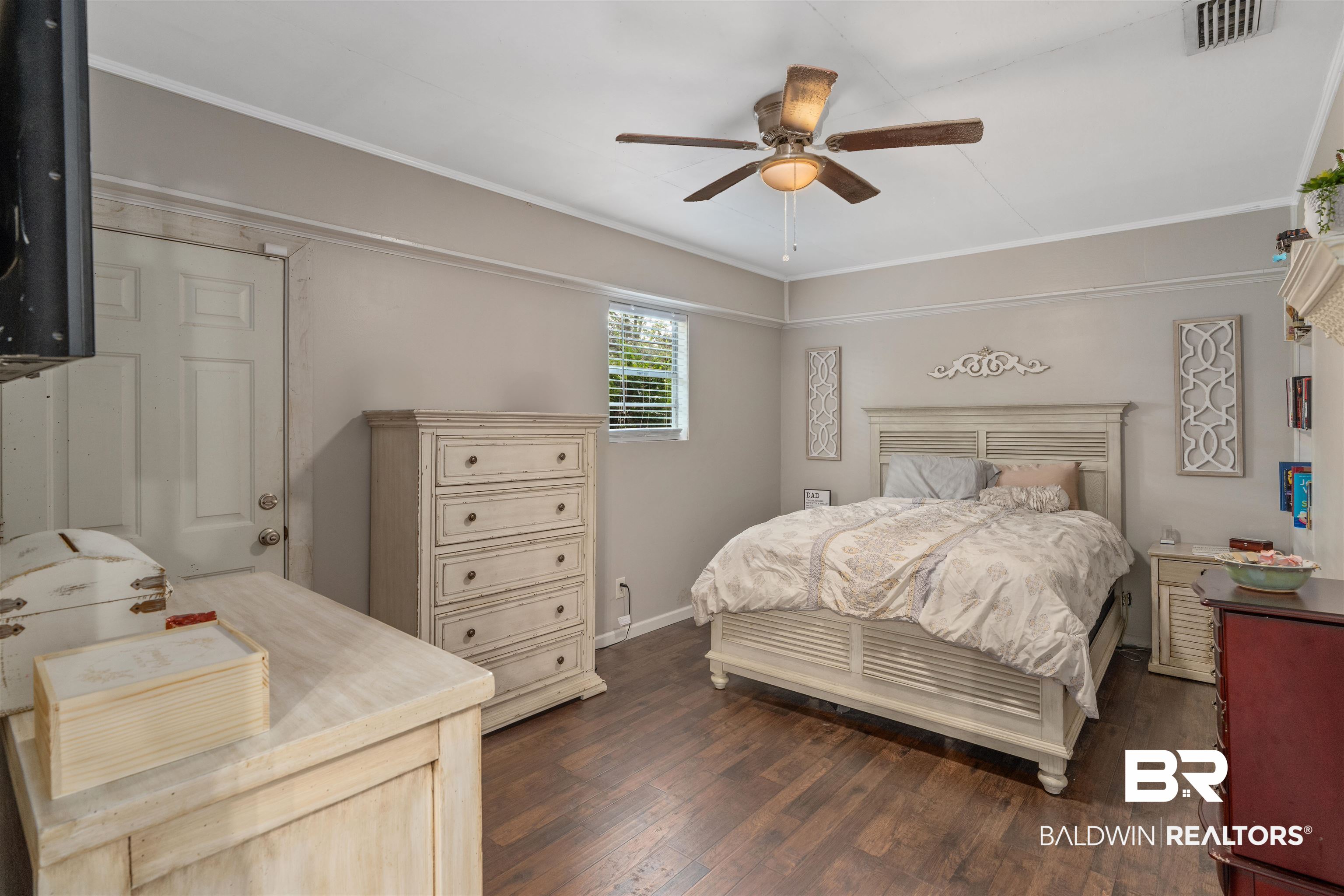 922 Dauphine Circle Daphne, AL 36526 - Photo 7 of 29 Bedroom featuring dark wood-type flooring, ceiling fan, and crown molding
