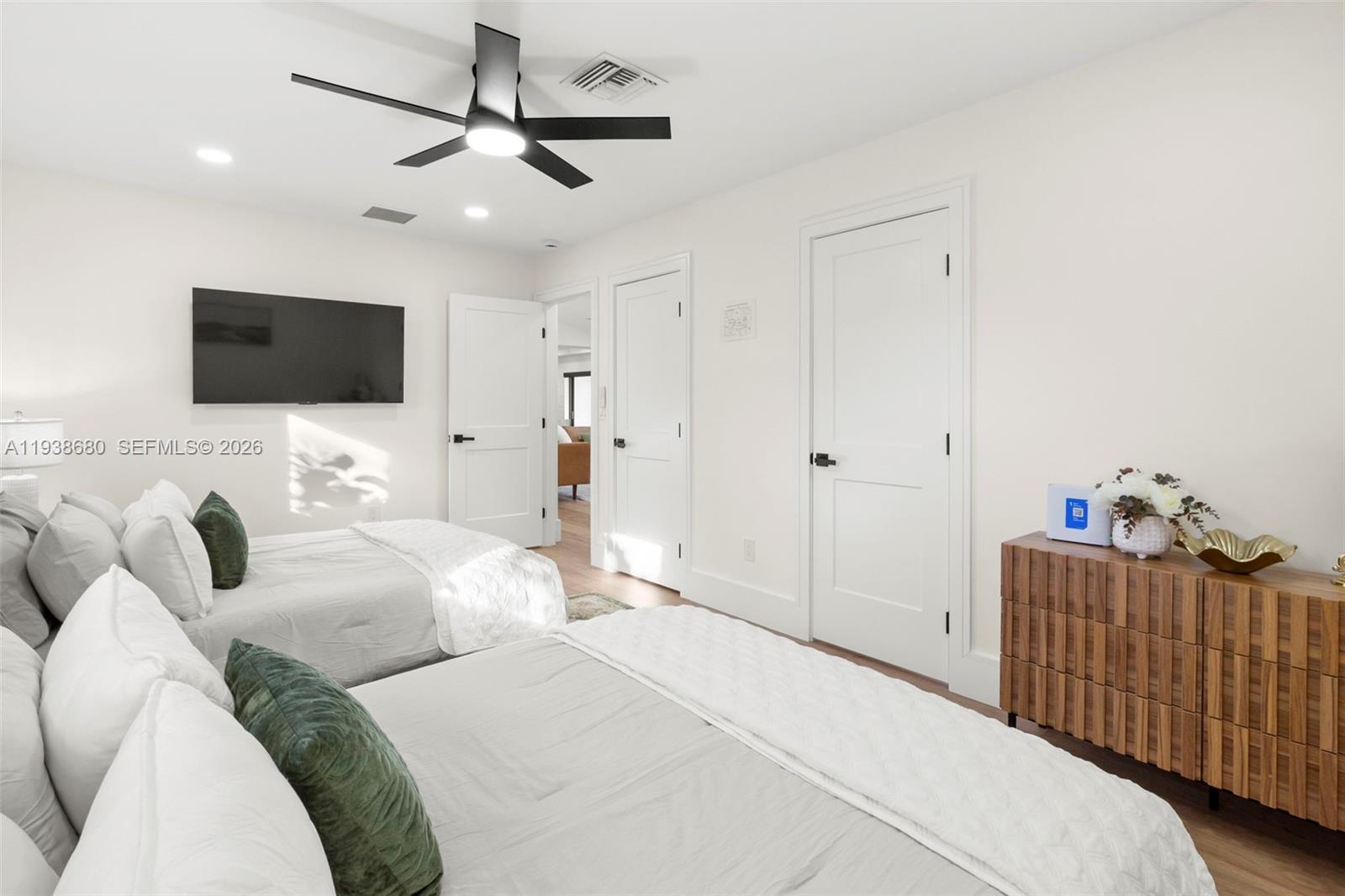 3540 Northeast 28th Avenue Lighthouse Point, FL 33064 - Photo 37 of 47 a bedroom with a bed window and a flat screen tv