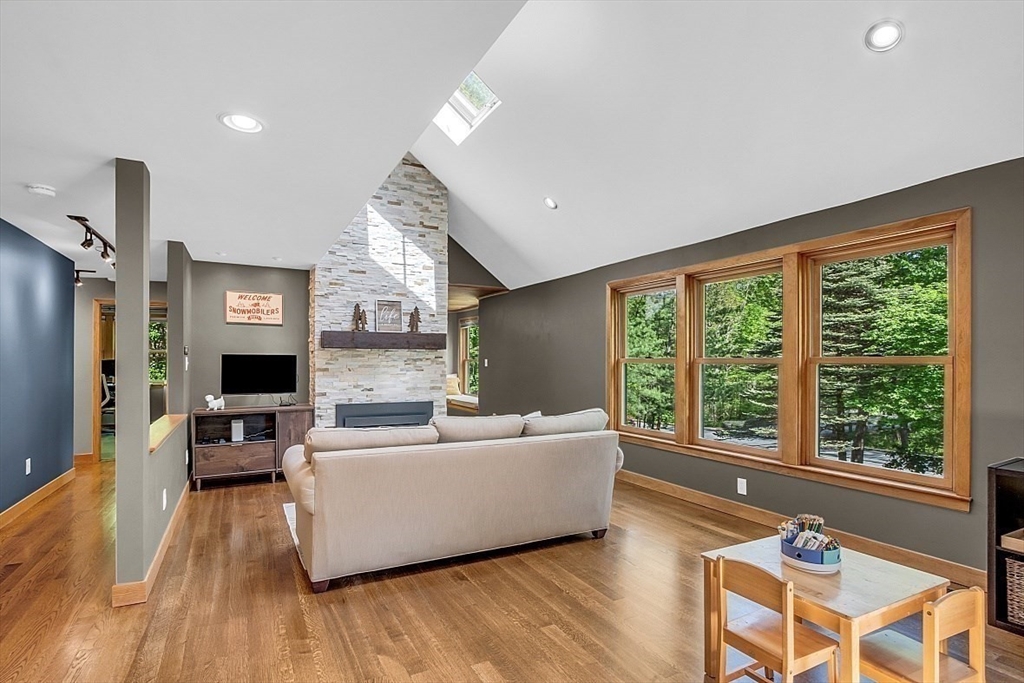 3 Valley Road North Reading, MA 01864 - Photo 13 of 42 a living room with furniture and a large window